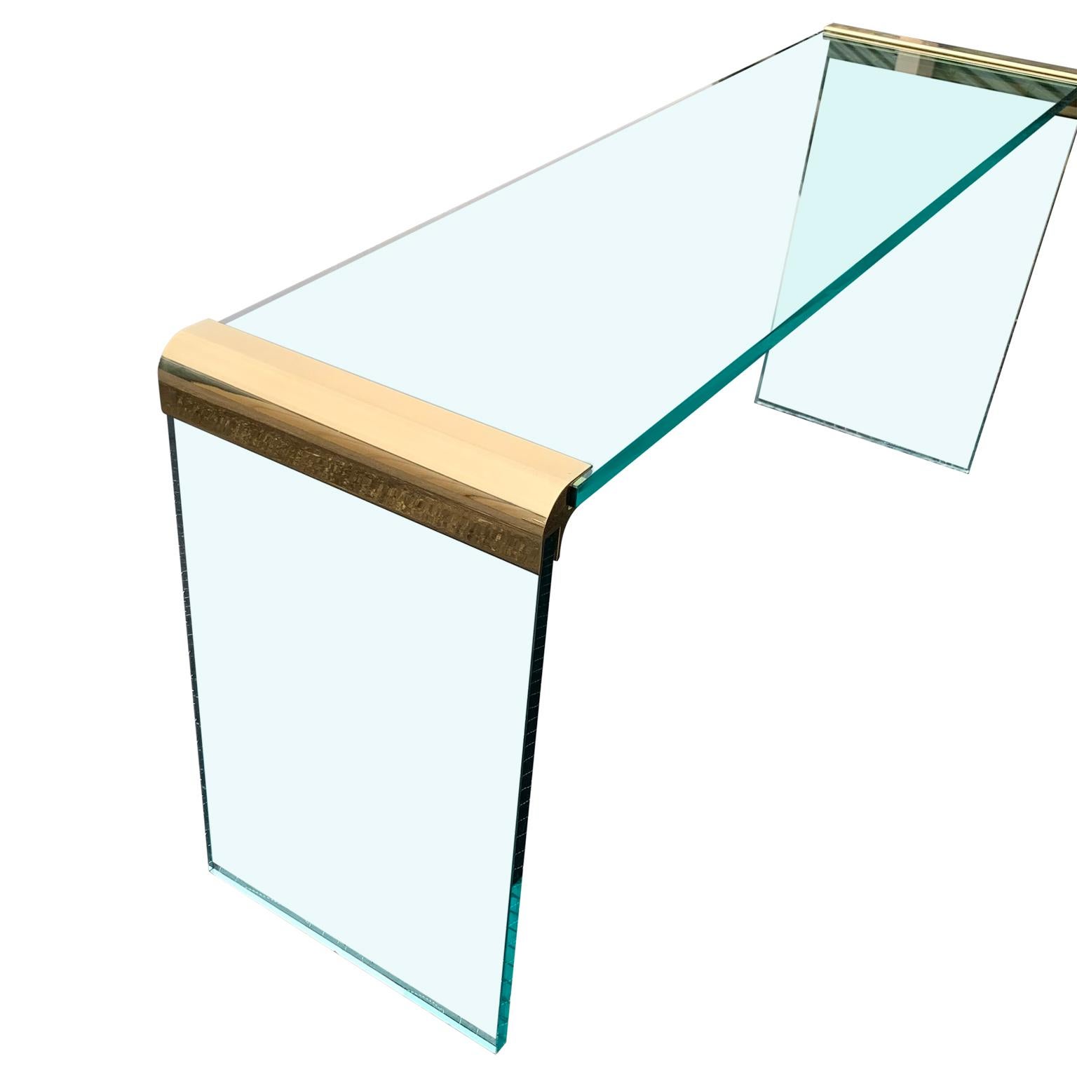 Narrow Mid-Century Modern brass glass top waterfall console table by Pace.
Glass is 3/4 inch thick (1,905 cm)