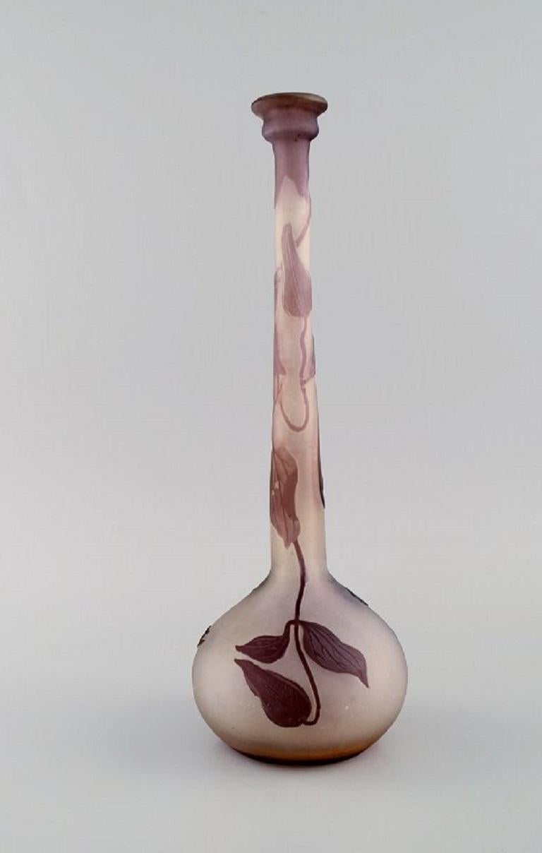 Narrow neck Emile Gallé vase in frosted and purple art glass carved in the form of foliage. 
Early 20th century.
Measures: 31.5 x 11 cm.
In excellent condition.
Signed.