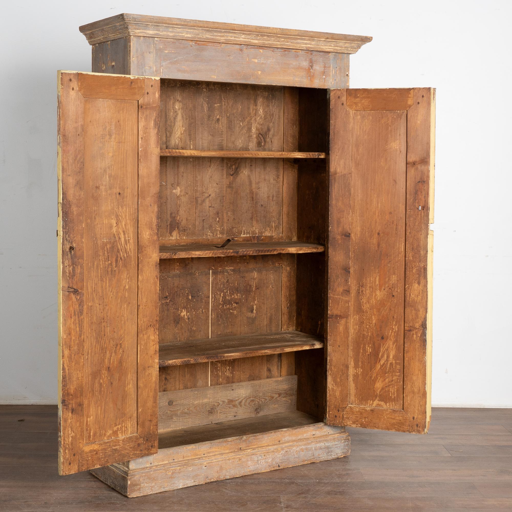 narrow wood armoire