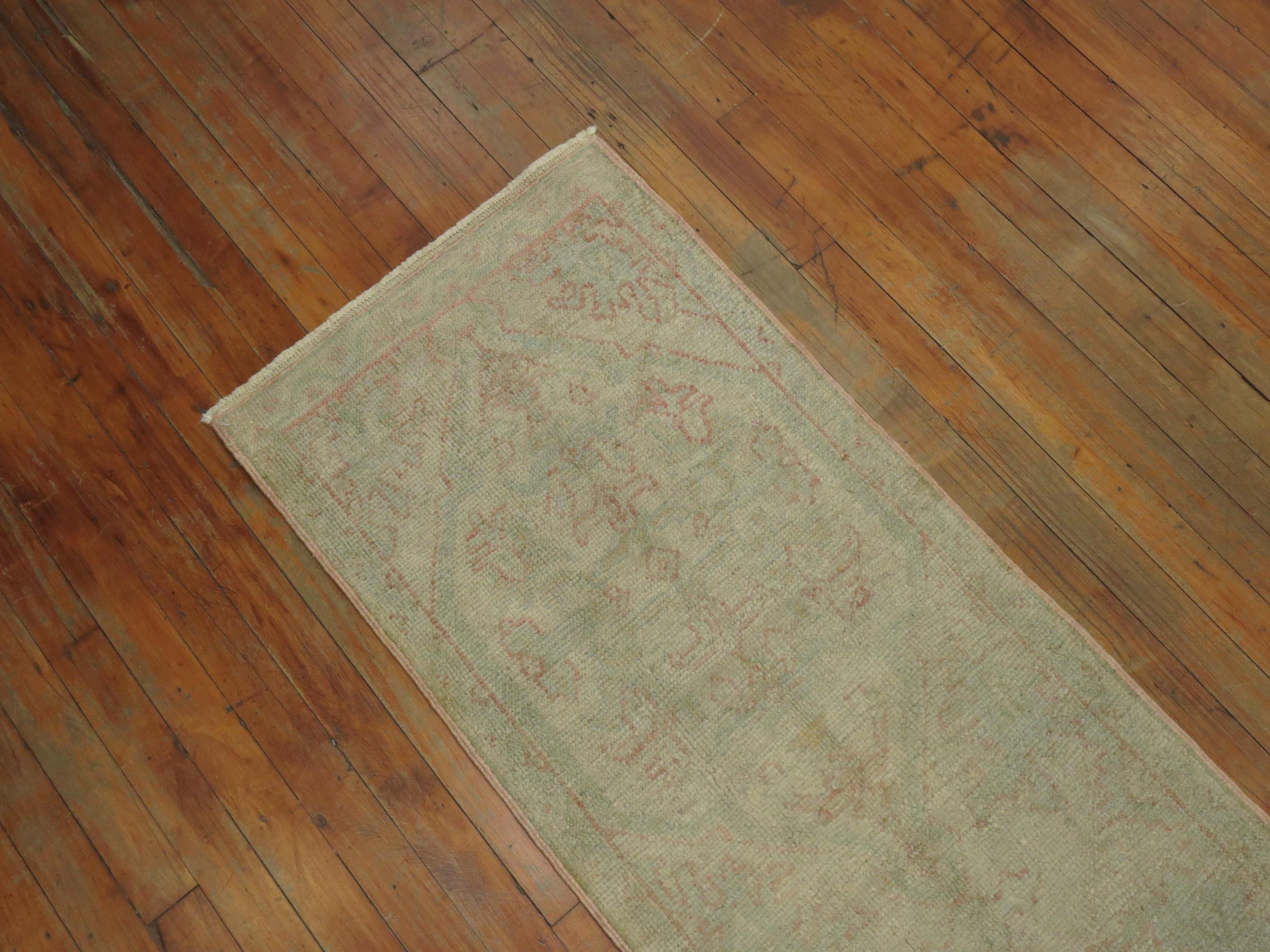 Archaistic Narrow Pale Antique Oushak Runner For Sale
