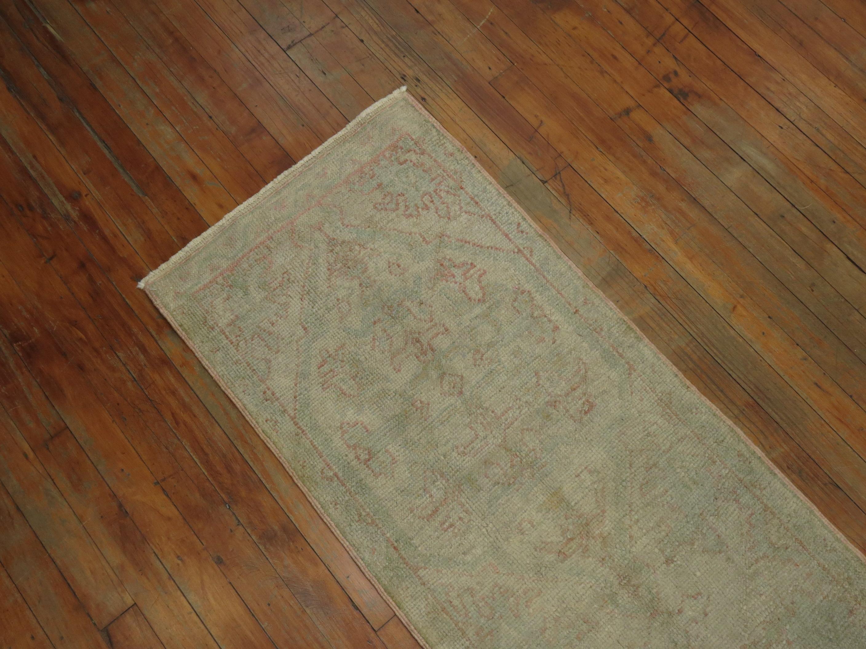 Hand-Knotted Narrow Pale Antique Oushak Runner For Sale
