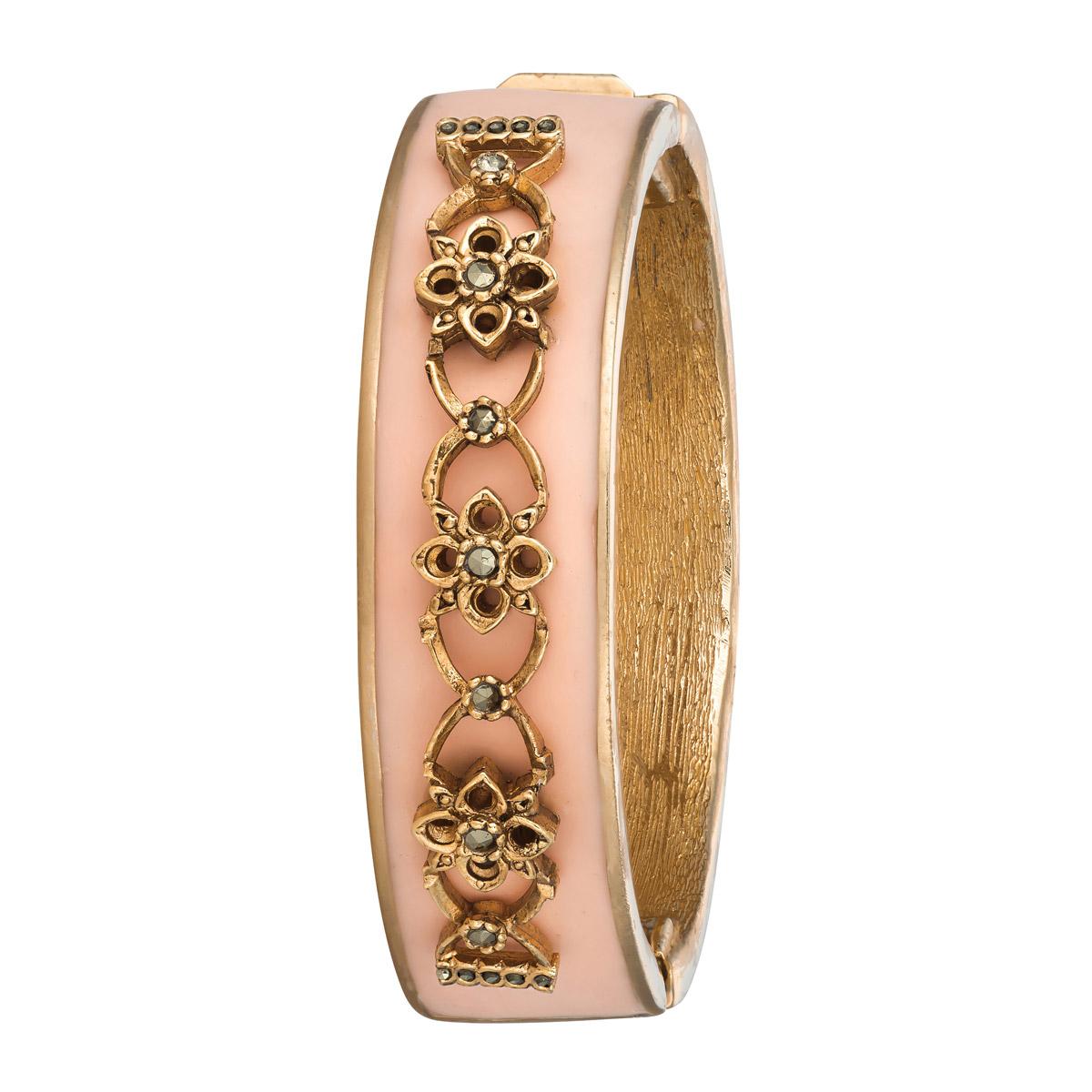 We simply adore the gorgeous pink color on this Narrow Secret Garden Bracelet. Inspire by vintage CINER compacts, this cuff adds the perfect amount of feminine charm to your jewelry repertoire. 

Materials:
Pewter
18K Gold Plating 
Box and Tongue