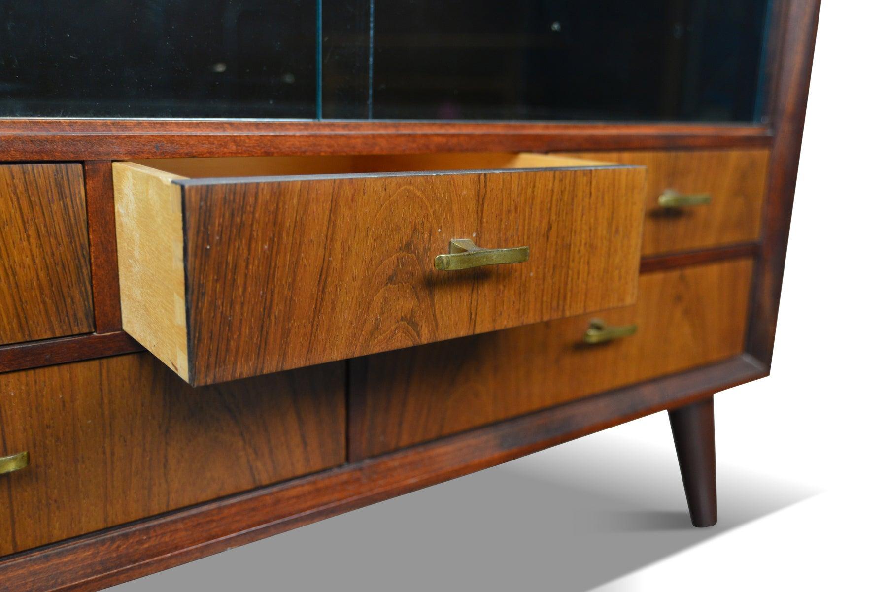 Origin: Denmark
Designer: Unknown
Manufacturer: Unknown
Era: 1960s
Materials: rosewood, brass, glass
Measurements: 29.5