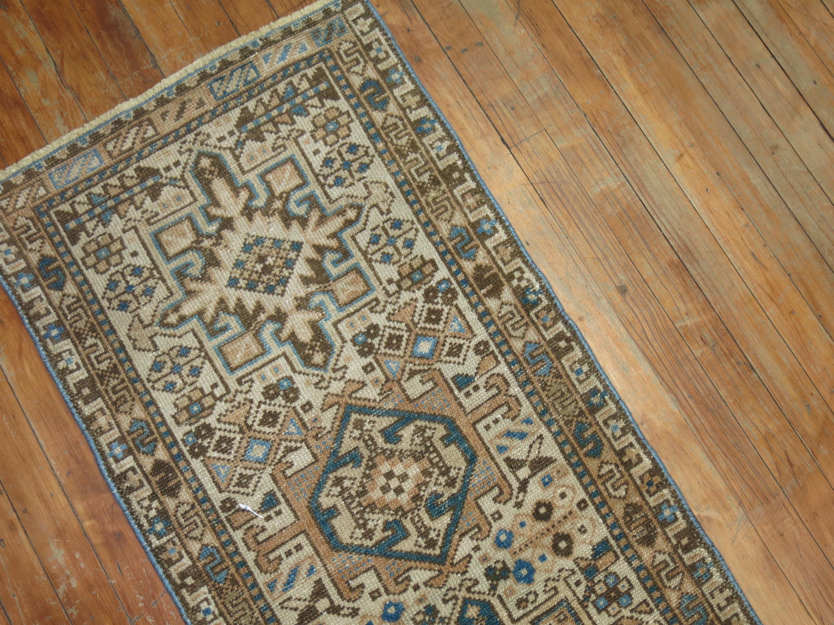 Very narrow one of a kind Persian Heriz runner from the second quarter of the 20th century. Blue, brown tones on an ivory ground. The size is original,

circa 1940s, measures: 1'11
