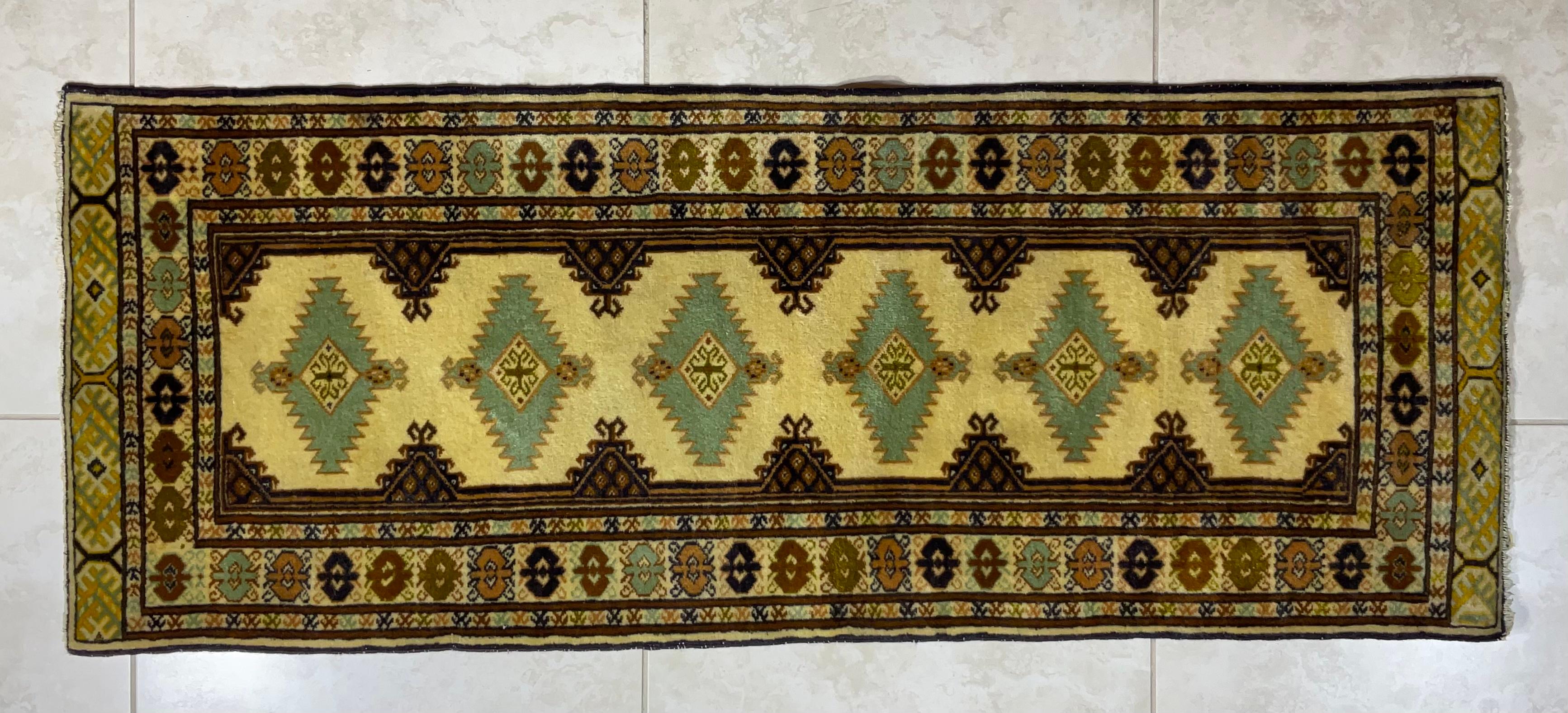 Fine quality hand woven rug geometric motifs with muted soft colors of cream , lime , Sand and camel . This piece of woven art runner is great floor cover for Narrow hall .
The rug is professionally hand washed and ready to use.
 