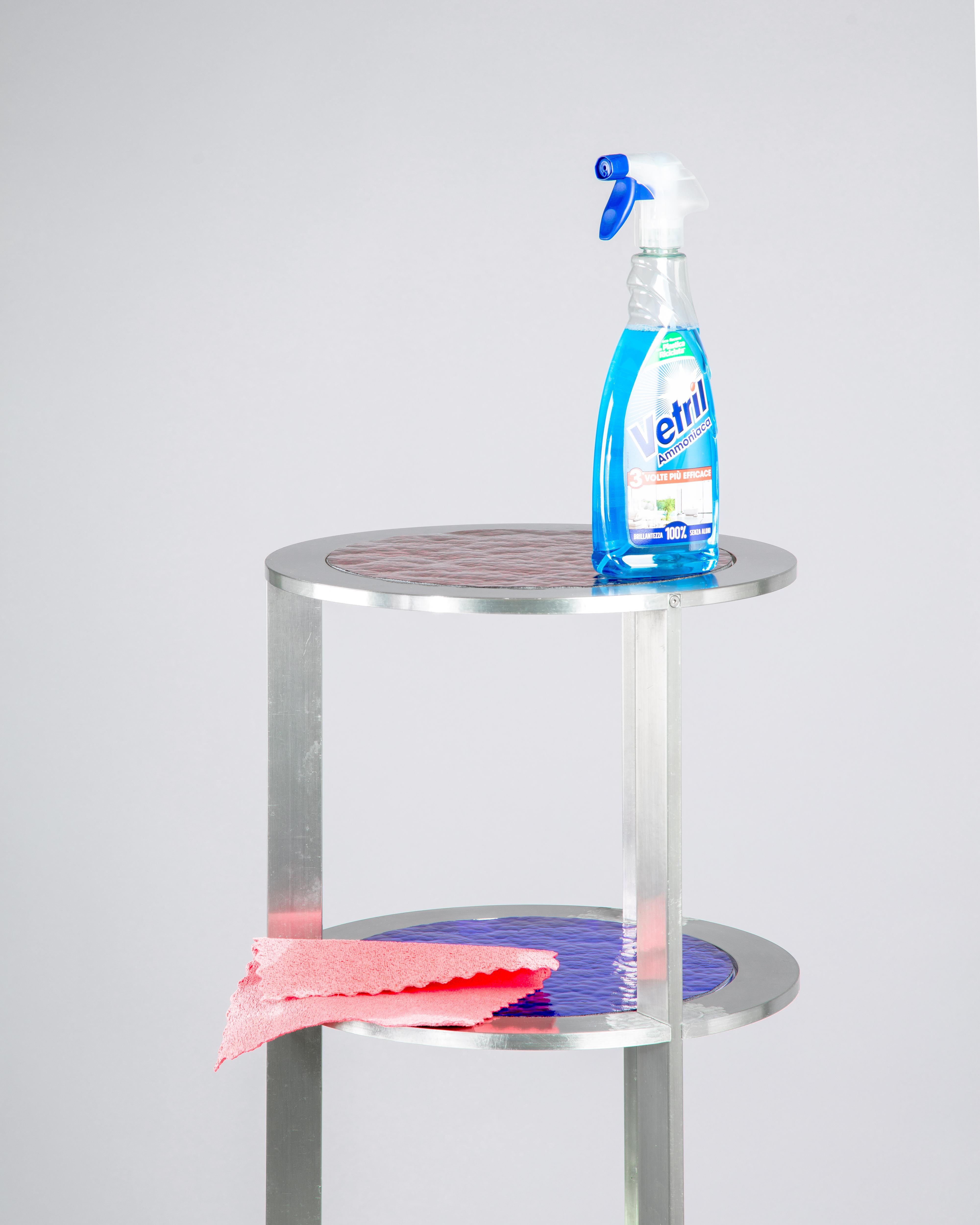 NASA Colonna shelf by Daniel Nikolovski
Dimensions: ø39 x H 120 cm
Materials: Aluminium, Colored Glass

NASA Colonna is a circular shelf that is composed from four aluminium rings containing multi-coloured cathedral glass. This flat-packed
