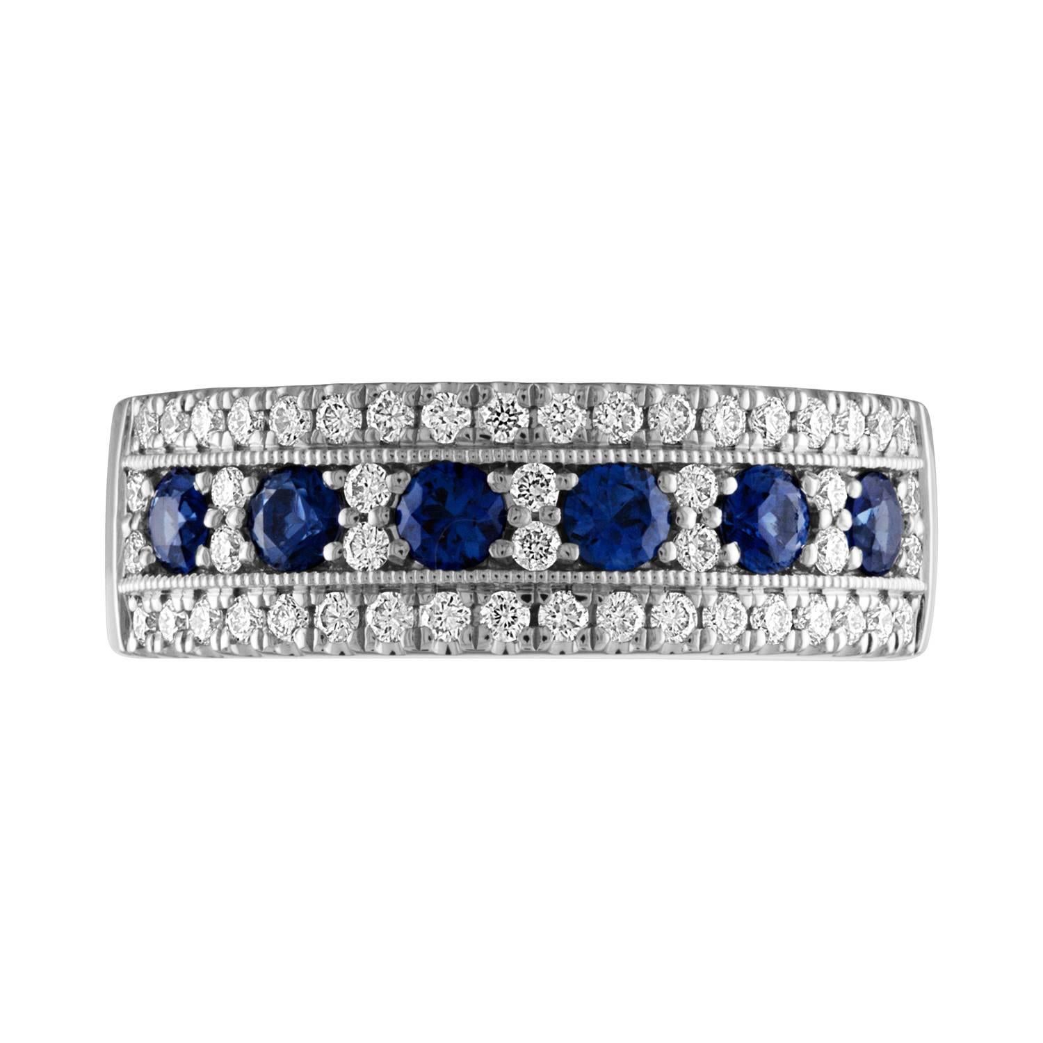 This classy and timeless band features 6 beautiful and sparkly sapphires.  The sapphires are surrounded by shiny brilliant cut diamonds.
Metal:  14k White
Sapphires:  6 round sapphires = .57ctw.  (2.70mm each)
50 round diamonds = .42ctw.  G, VS2