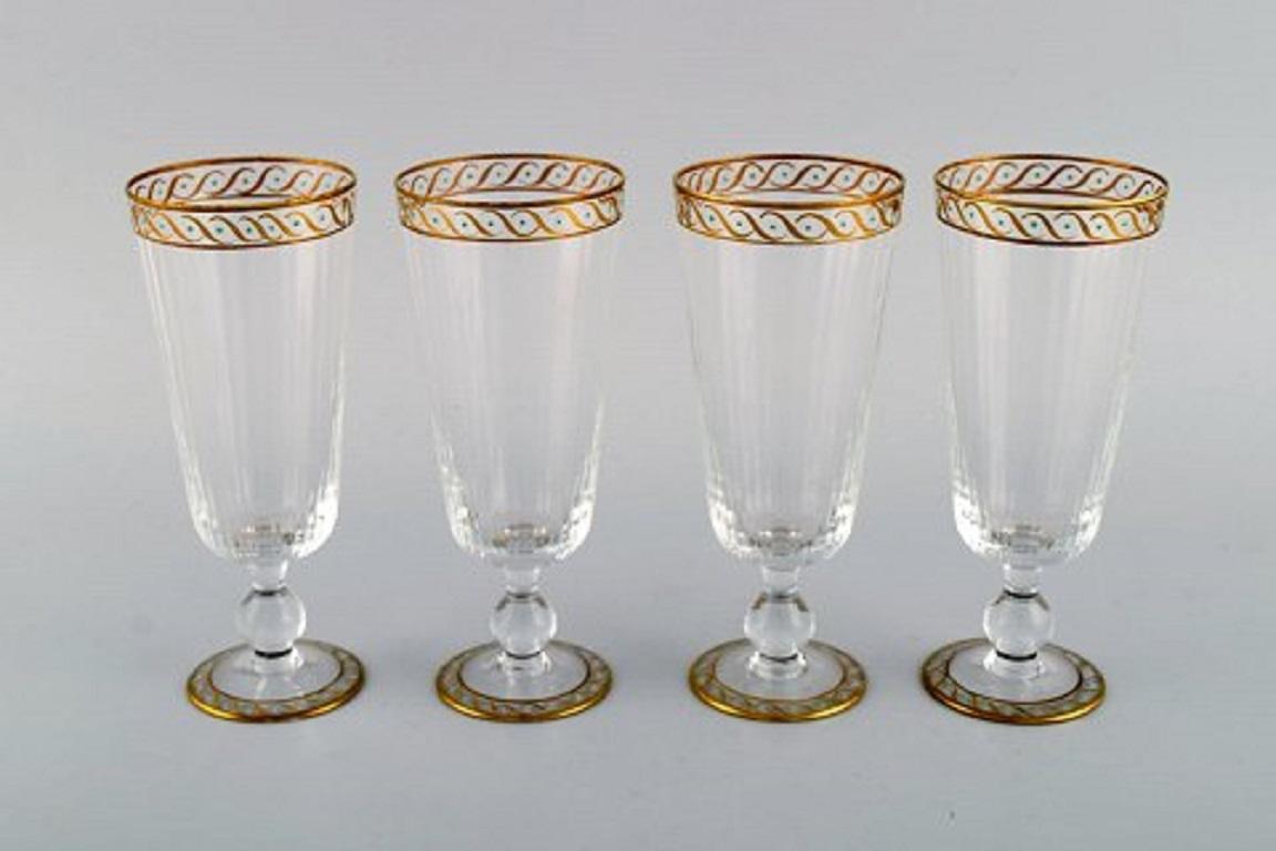 Nason & Moretti, Murano. Four champagne flutes in mouth-blown art glass with hand-painted turquoise and gold decoration. 1930s.
Measures: 16 x 6.5 cm.
In excellent condition.
