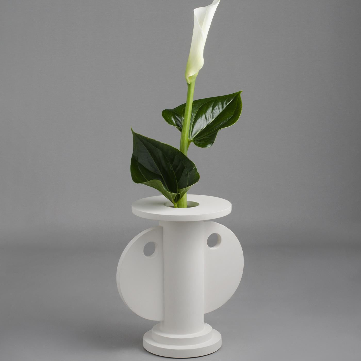 Part of the numbered NAT Collection of vases and centerpieces designed by Nathalie du Pasquier between 1989/90, this white vase has a main hollow cylinder, whose round circles at the base and top recall a Greek column, and two large wings