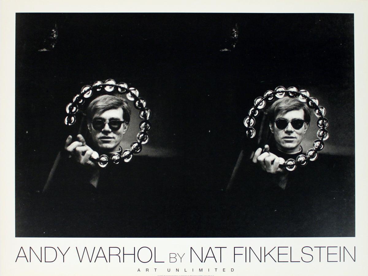 This is a reproduction of Andy Warhol and Double Tambourine by Nat Finkelstein. The image features a side-by-side double exposure of Warhol holding a tambourine in front of him, with his face visible through the tambourine’s circular frame.