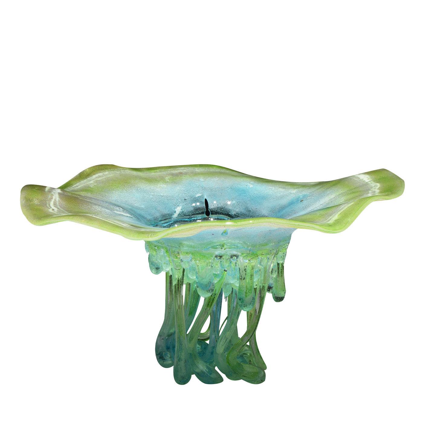 This unique, stunning sculpture in hues of green and blue is made from Murano glass and luminescent materials that cast a shadow on the surface where the sculpture is placed, created a soft effect. The edges of the top of the sculpture are