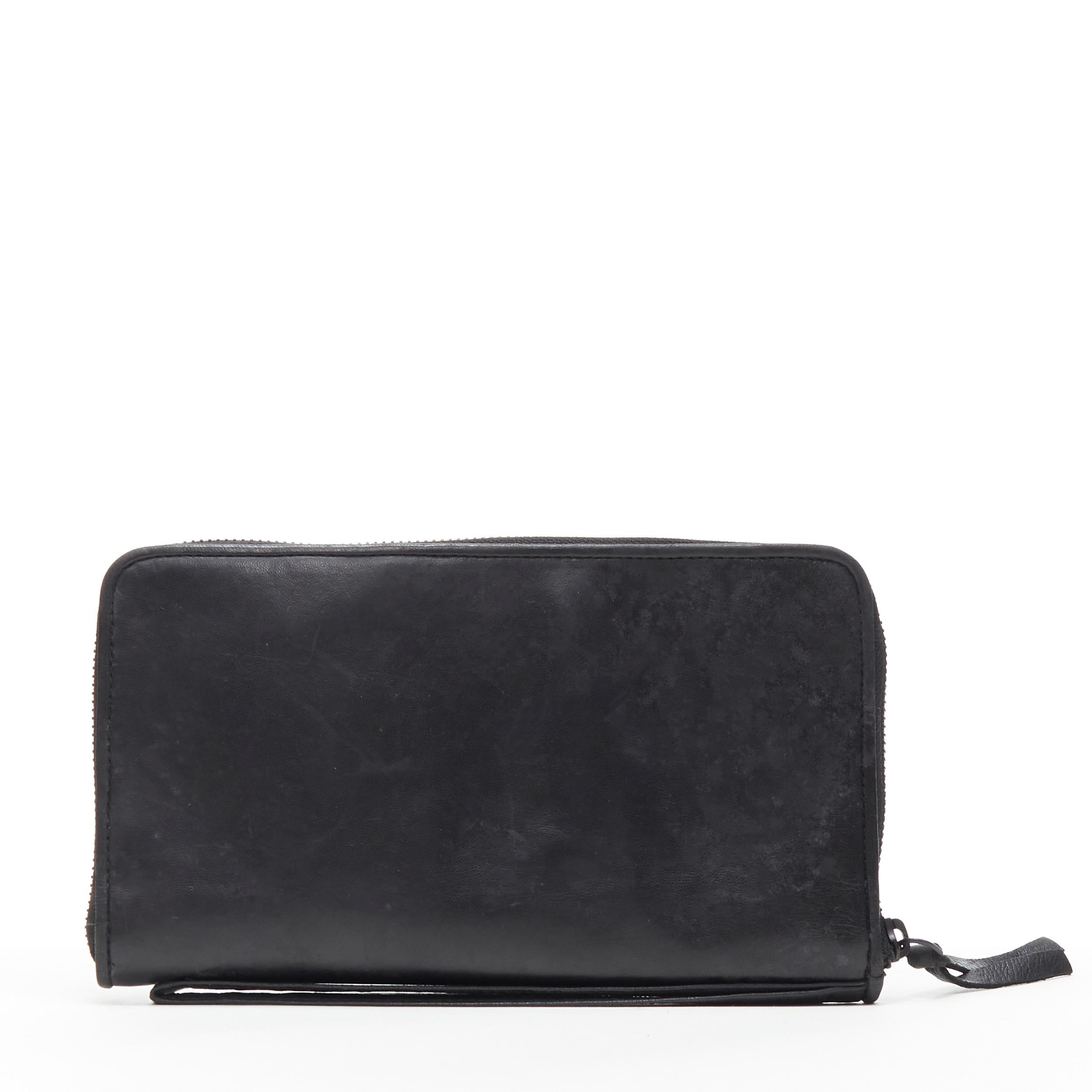 NATALIA BRILLI surrealist card coins shadow deboss black zip clutch bag 
Reference: CAWG/A00166 
Brand: Natalia Brilli
Designer: Natalia Brilli 
Model: Surrealist zip clutch 
Material: Leather 
Color: Black
 Pattern: Solid 
Closure: Zip 
Extra