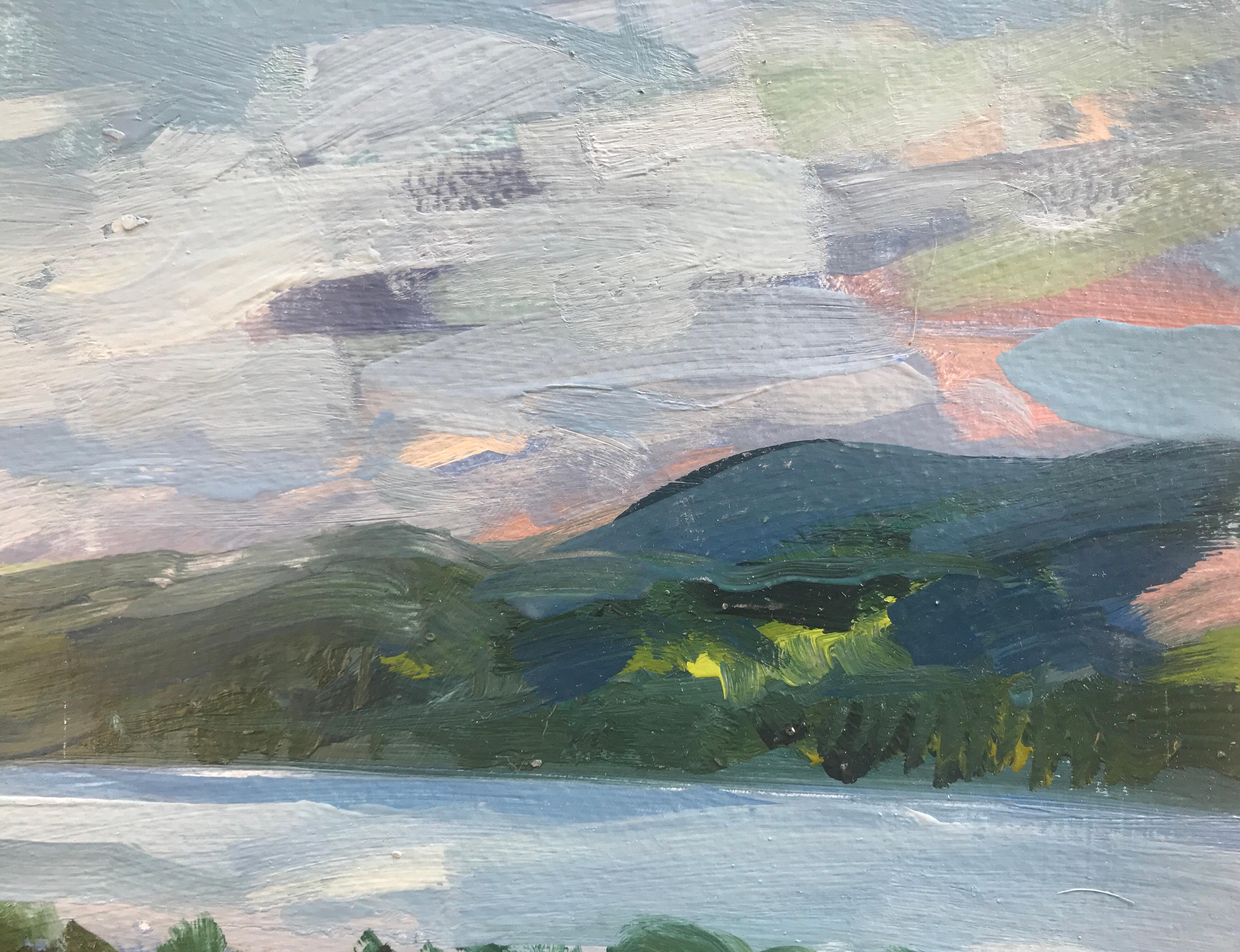 Still day by the loch by Natalie Bird is an impressionist style painting of a Scottish landscape. Hills and mountains appear in the background of the loch in different tones of blue. In tones of green, the trees in foreground can be