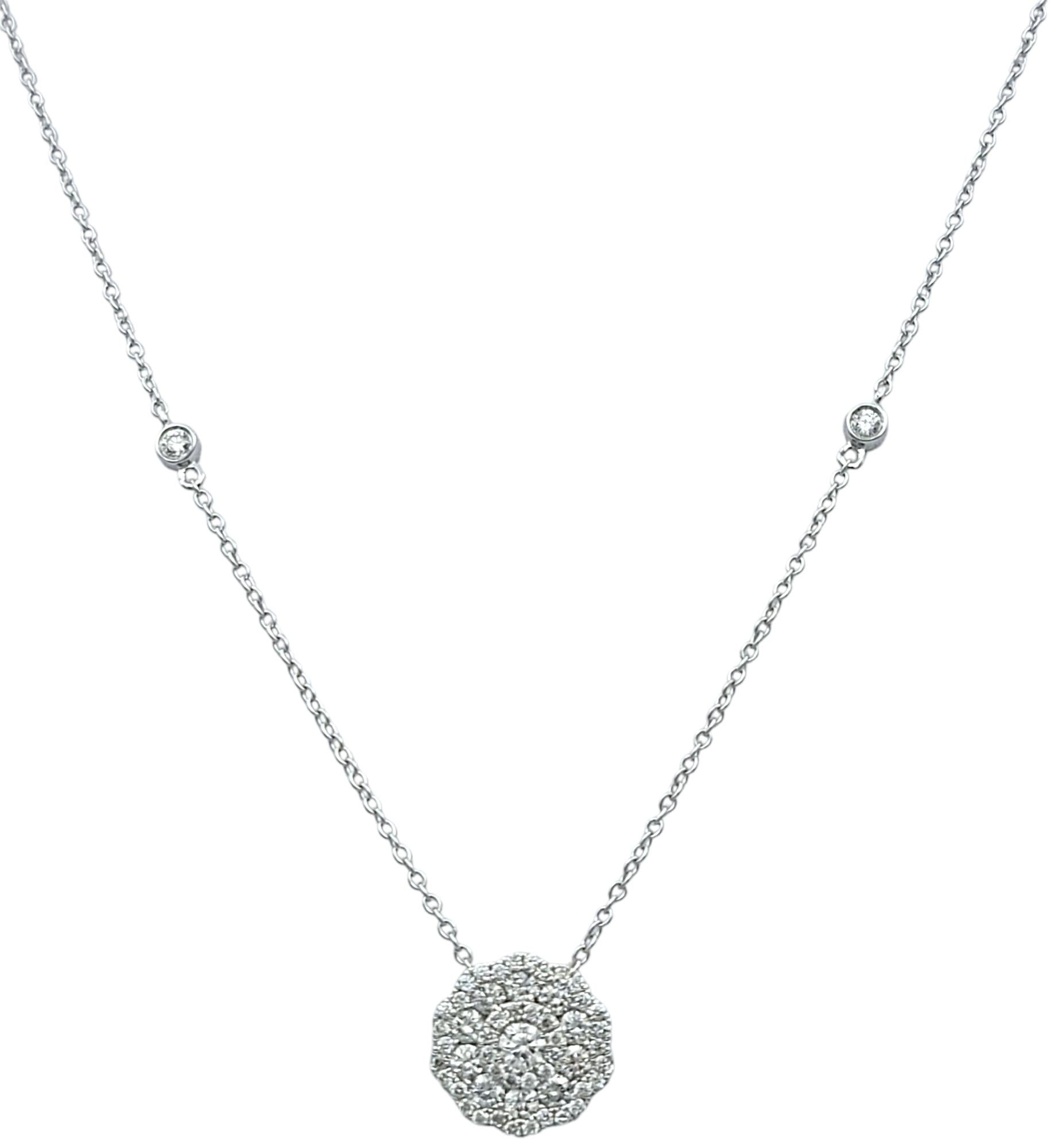 Elevate your elegance with this exquisite pendant necklace from Natalie K. by M.K., a perfect blend of artistry and luxury. Crafted in luminous 18 karat white gold, this necklace showcases a dazzling diamond floral motif, radiating grace and