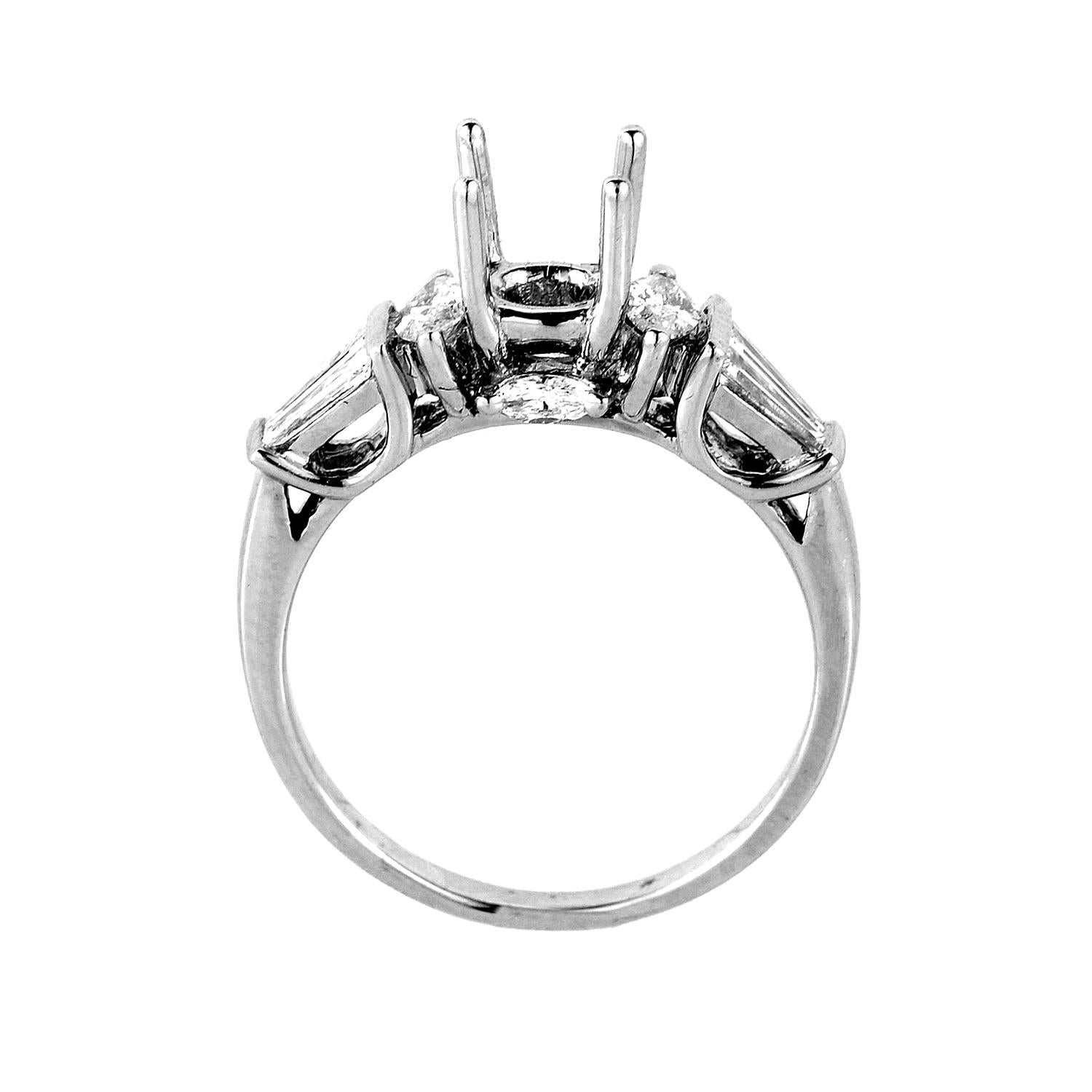 This gorgeous engagement ring setting from Natalie K is chic and refined; perfect for a lady with timeless style. The setting is made of 14K white gold and features ~.68ct of diamonds. There are two sets of side stones; one set boasts a marquise cut