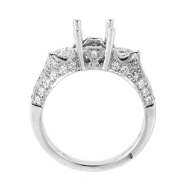 This gorgeous engagement ring setting from Natalie K is chic and refined; perfect for a lady with timeless style. The setting is made of 14K white gold and boasts ~.75ct of diamonds. The side stones boasts a pear shape and the remainder of the