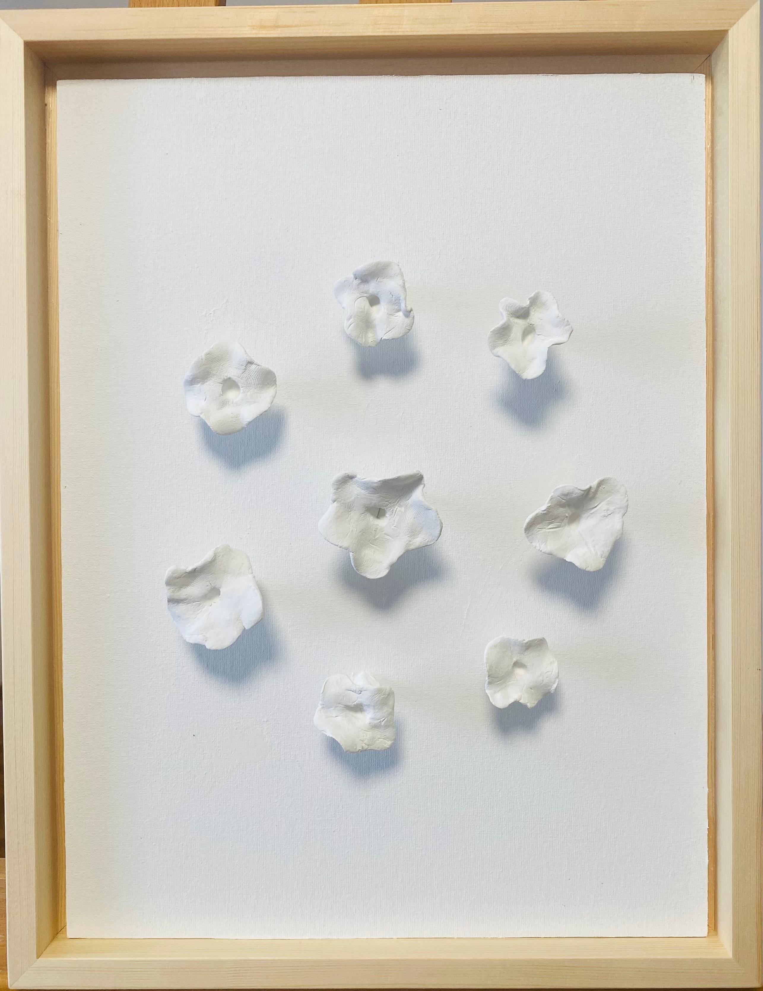 I created this piece to celebrate the quiet beauty and resilience found in simplicity. Using ceramics and clay, I shaped delicate petals that bloom in pristine white, inviting calm and purity into your space. The layered texture symbolizes growth