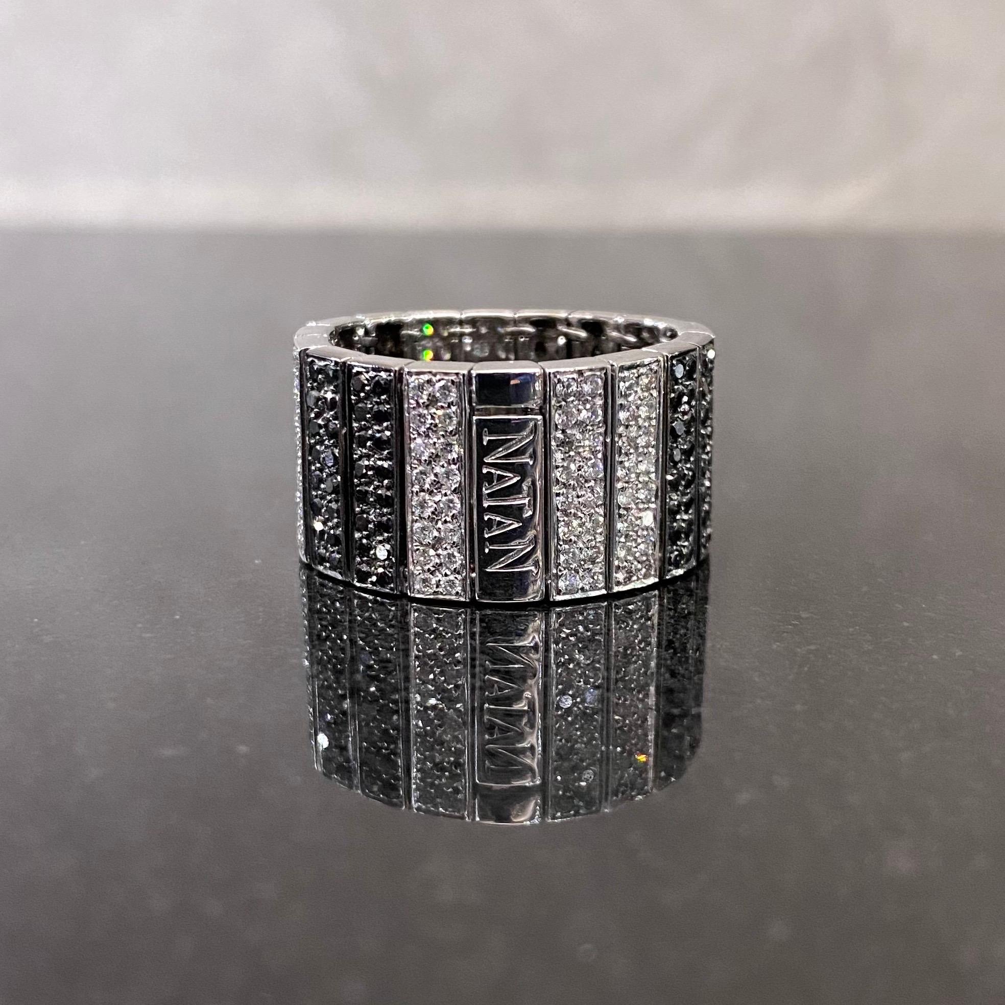 Natan colorless diamond and fancy black diamond geometric articulated band ring in 18 karat white and blackened gold, 2000s. This ring is designed as a sequence of 18 rectangular sections seamlessly articulated, one in polished white gold signed