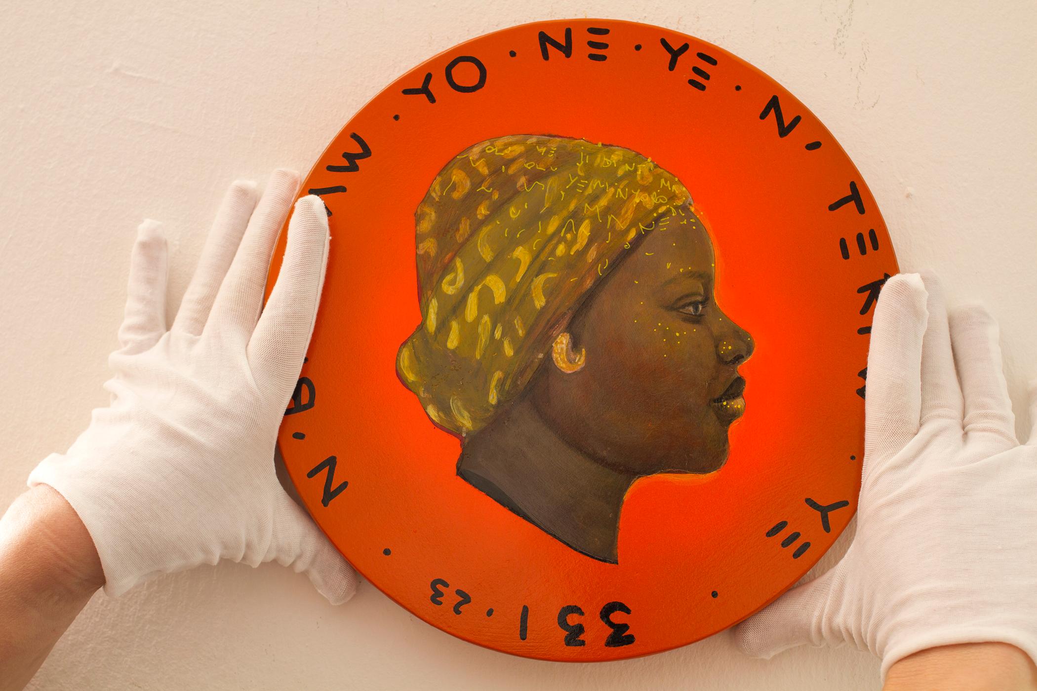 African Woman Profile Colorful Portrait on Wooden Coin. Orange 