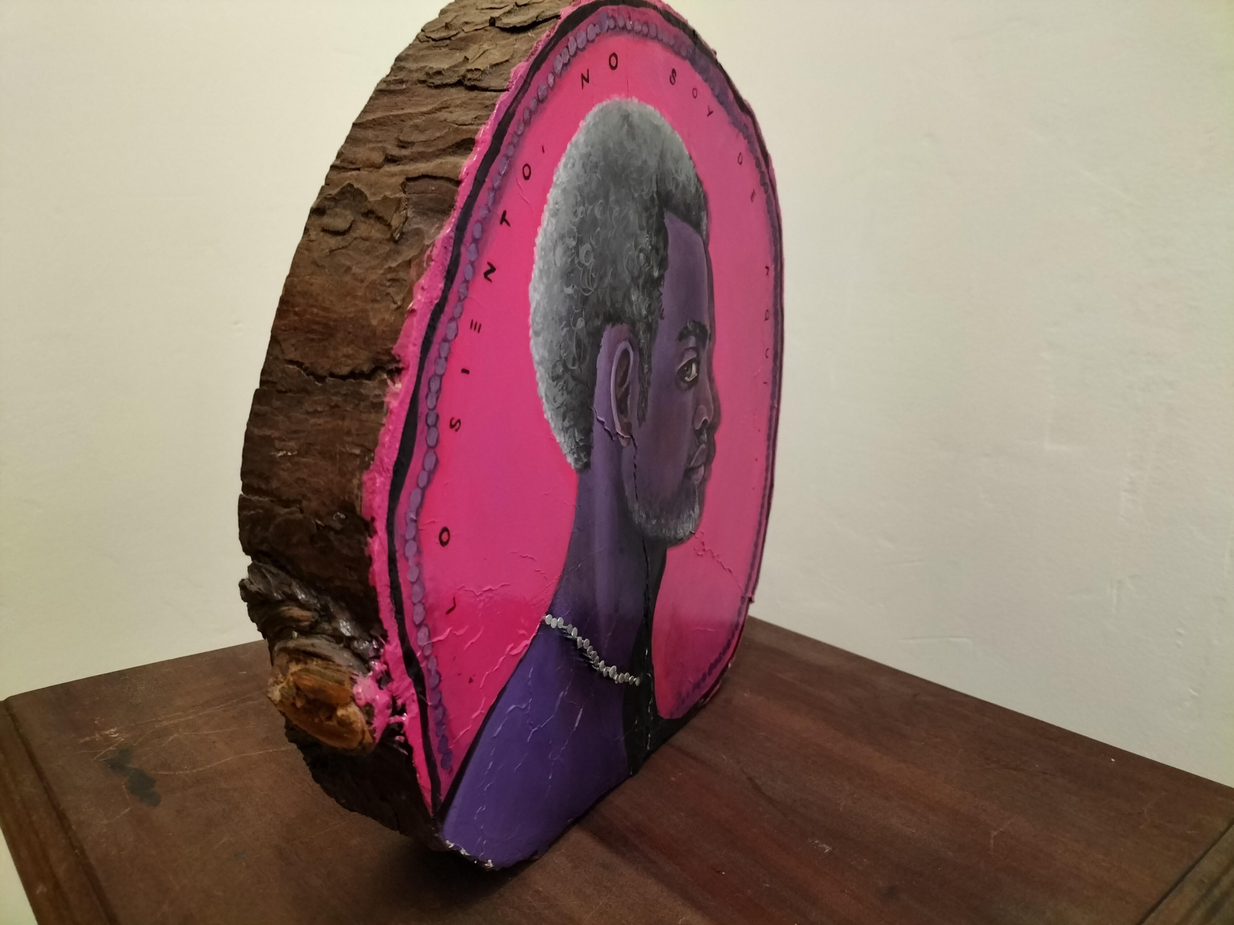 This sculptural and pictorial piece is designed to be displayed on a wall or directly on furniture or a pedestal. It is crafted on a thick cypress wood slice, properly treated for preservation, and features a profile portrait of a black man
