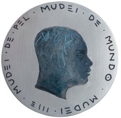 Portrait masculin sur fond d'argent sur une pièce de monnaie avec inscription en galicien. "Devise n°265
