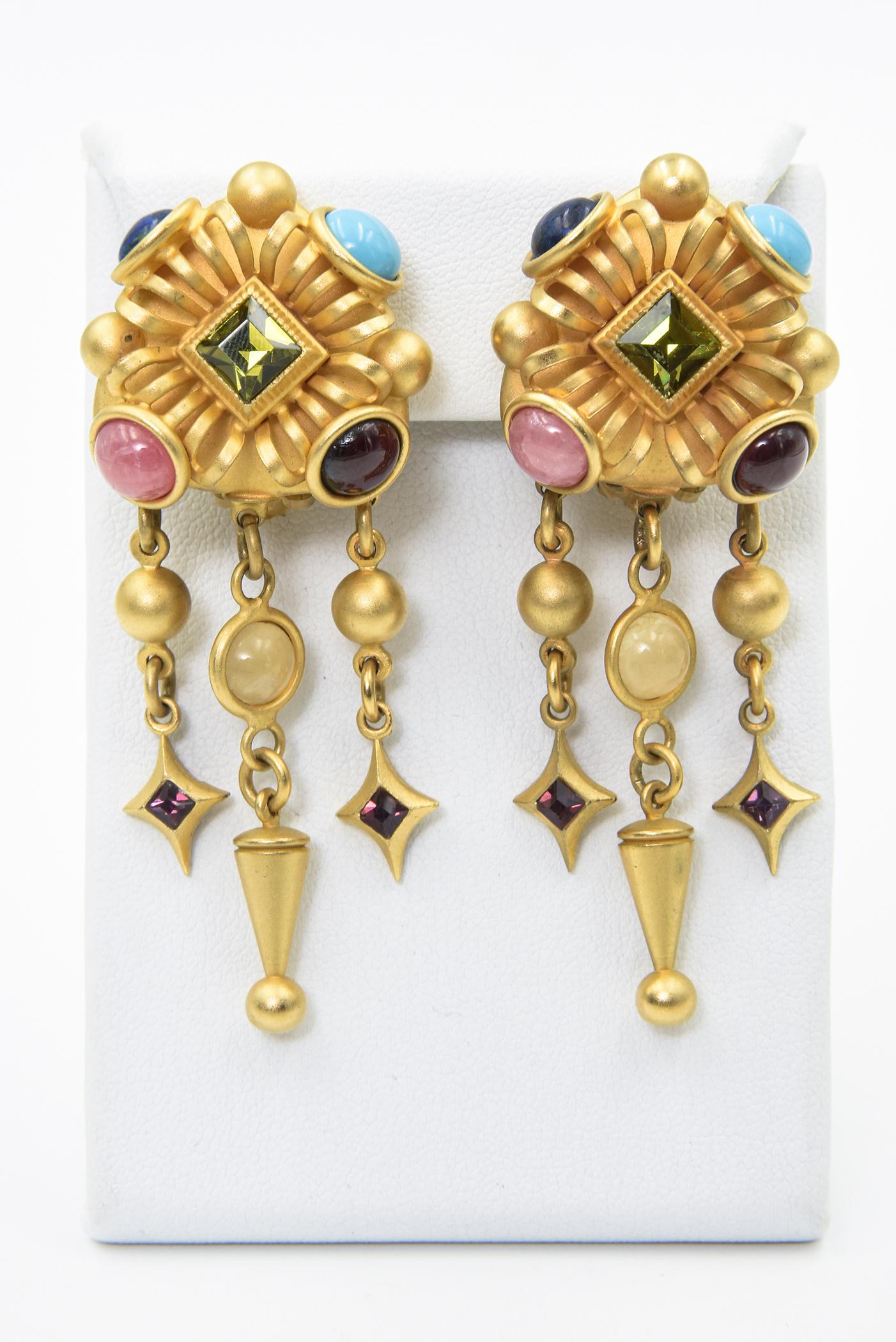 Vintage 20th Century Natasha Stambouli 24K gold-plated brass chandelier earrings. Set with lapis lazuli, garnet, amazonite, and quartz cabochons; accented with Austrian crystals. Clip backs. Signed: Natasha Stambouli. Some wear, one replaced