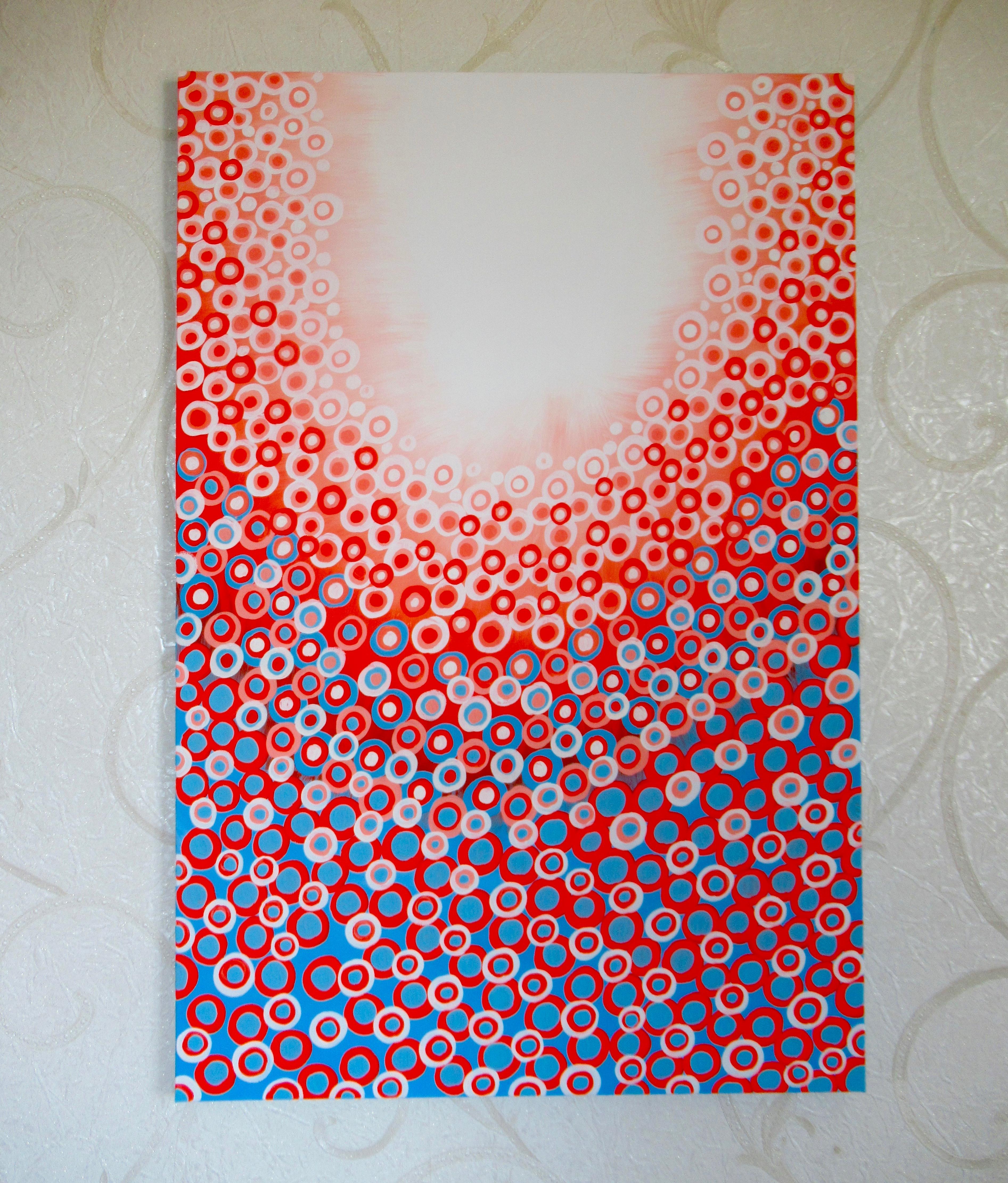 <p>Artist Comments<br />A luminous combination of red, blue, and white circles radiate from above, silhouetted by the bright morning sun. They cascade down like individual rays of light. Part of Natasha Tayles's signature Circles series.</p><br
