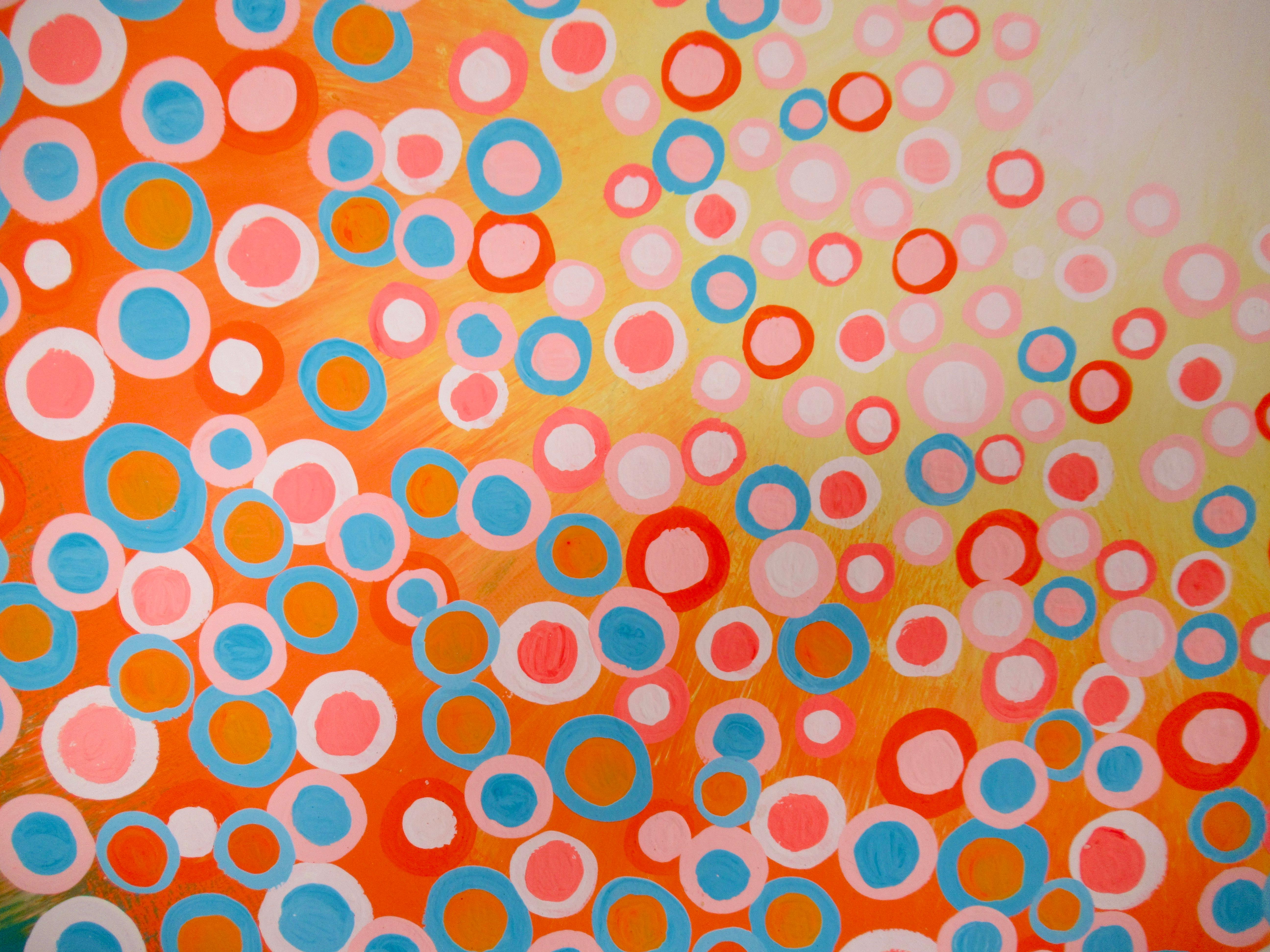<p>Artist Comments<br>Part of artist Natasha Tayles's signature Circles series. Inspired by warm spring sunny days, Natasha paints sprightly circles in orange, yellow, salmon, and blue. The orbs spread and gather above a delightfully harmonious