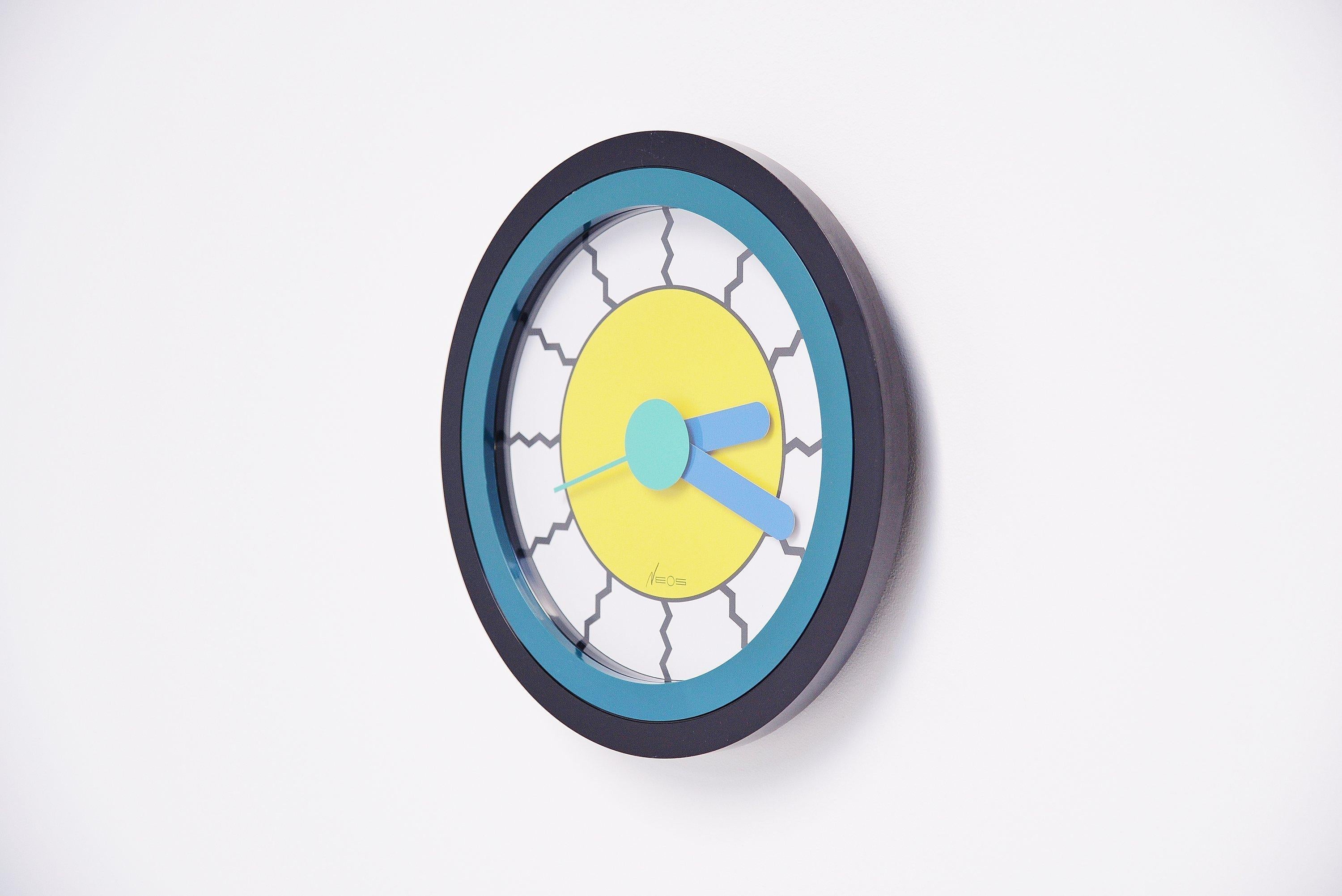 Memphis wall clock designed by Nathalie du Pasquier and George Sowden and manufactured by Neos, Italy, 1988. The style of this clock represents the Memphis period at its best, the style and color usage are completely where that period stood for. Du