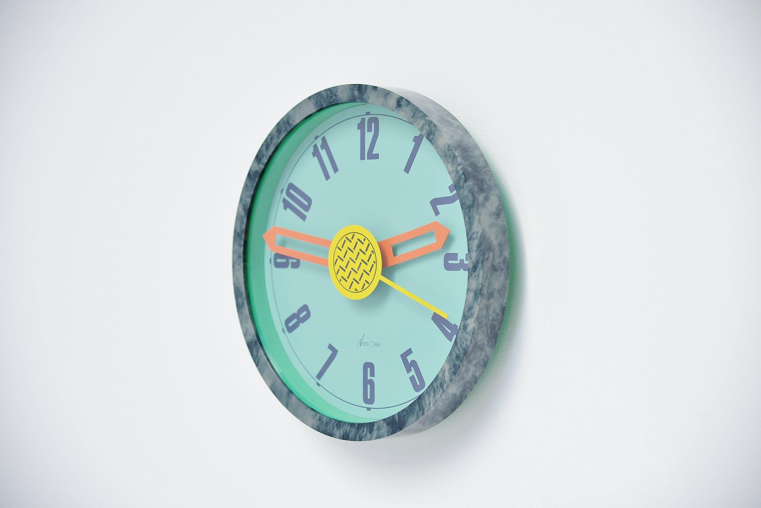 Memphis era wall clock designed by Nathalie du Pasquier and George Sowden and manufactured by Neos, Italy, 1988. The style and materials used for this clock represents the Memphis period at its best, the style and color usage are completely where
