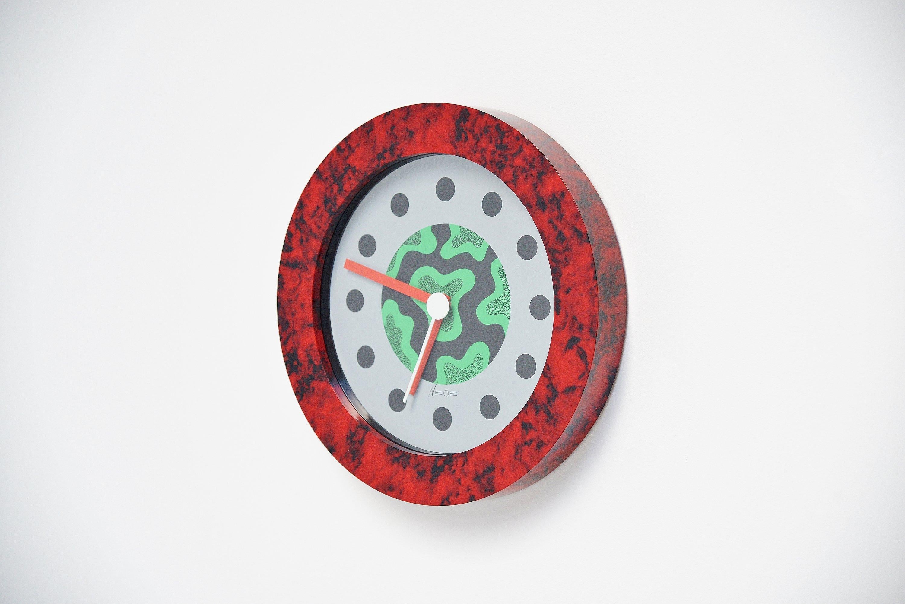 Postmodern wall clock designed by Nathalie du Pasquier and George Sowden and manufactured by Neos, Italy, 1988. This clock is one of the nicest from the collection if you ask me as it represents the Memphis period at its best. du Pasquier and Sowden