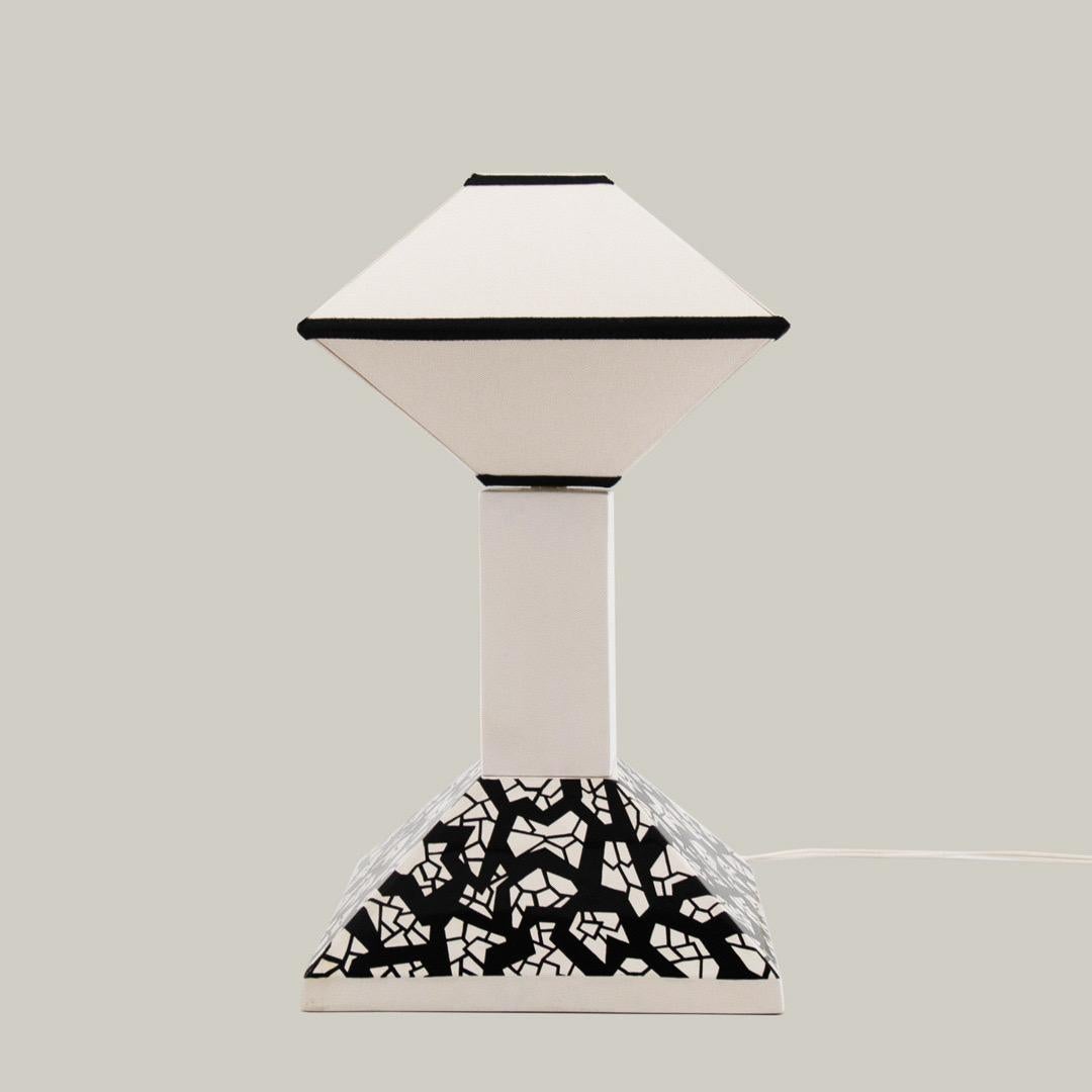 This Memphis lamp was designed by Nathalie du Pasquier and edited by Drimmer c. 1985. 

The lamp is the number 67 of a limited edition of 200.

Nathalie du Pasquier, Memphis lamp, Edited by Drimmer, c. 1985.