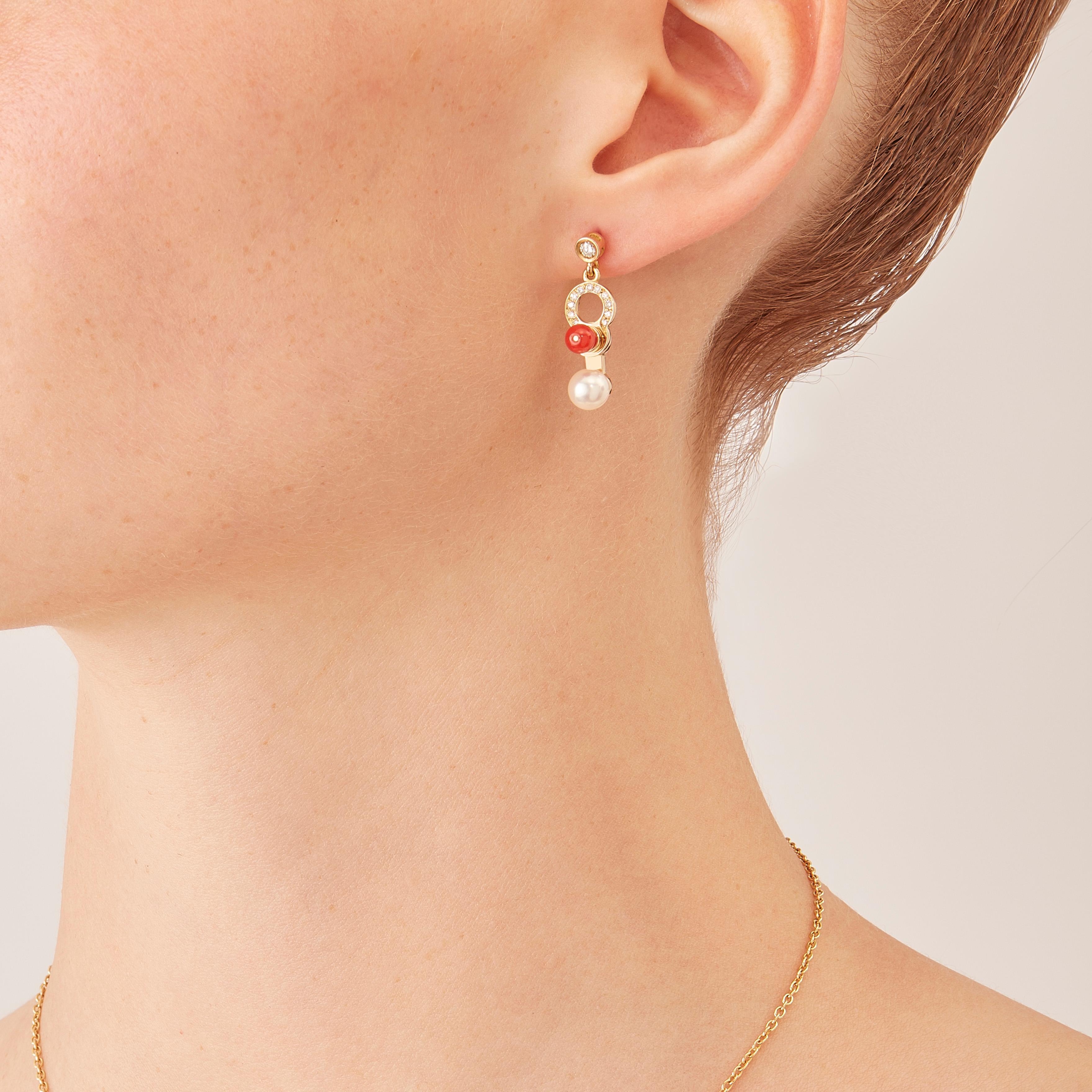Made by hand in Nathalie Jean's Milan atelier, Microcosmos drop earrings, are devised as a game, a construction or a sophisticated aerial mobile. Shapes attached to rings dangle lightly on the ear, their geometry pierced by diamonds (0,21 carats),