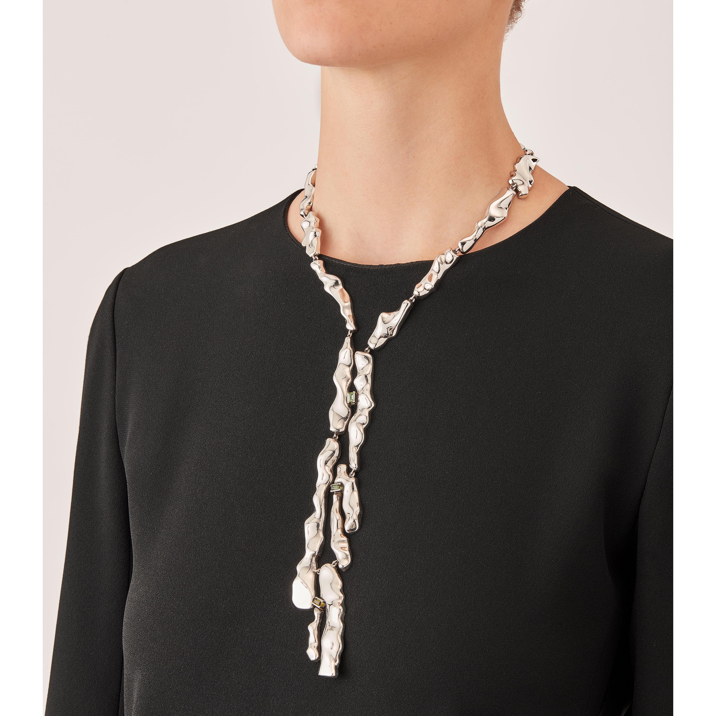 Made by hand in Nathalie Jean's Milan atelier in limited edition, the Mercure Tie drop necklace is composed of 19 elements of varying dimensions in rhodium plated sterling silver. Clever hidden links allow the pieces to drape nicely around the neck