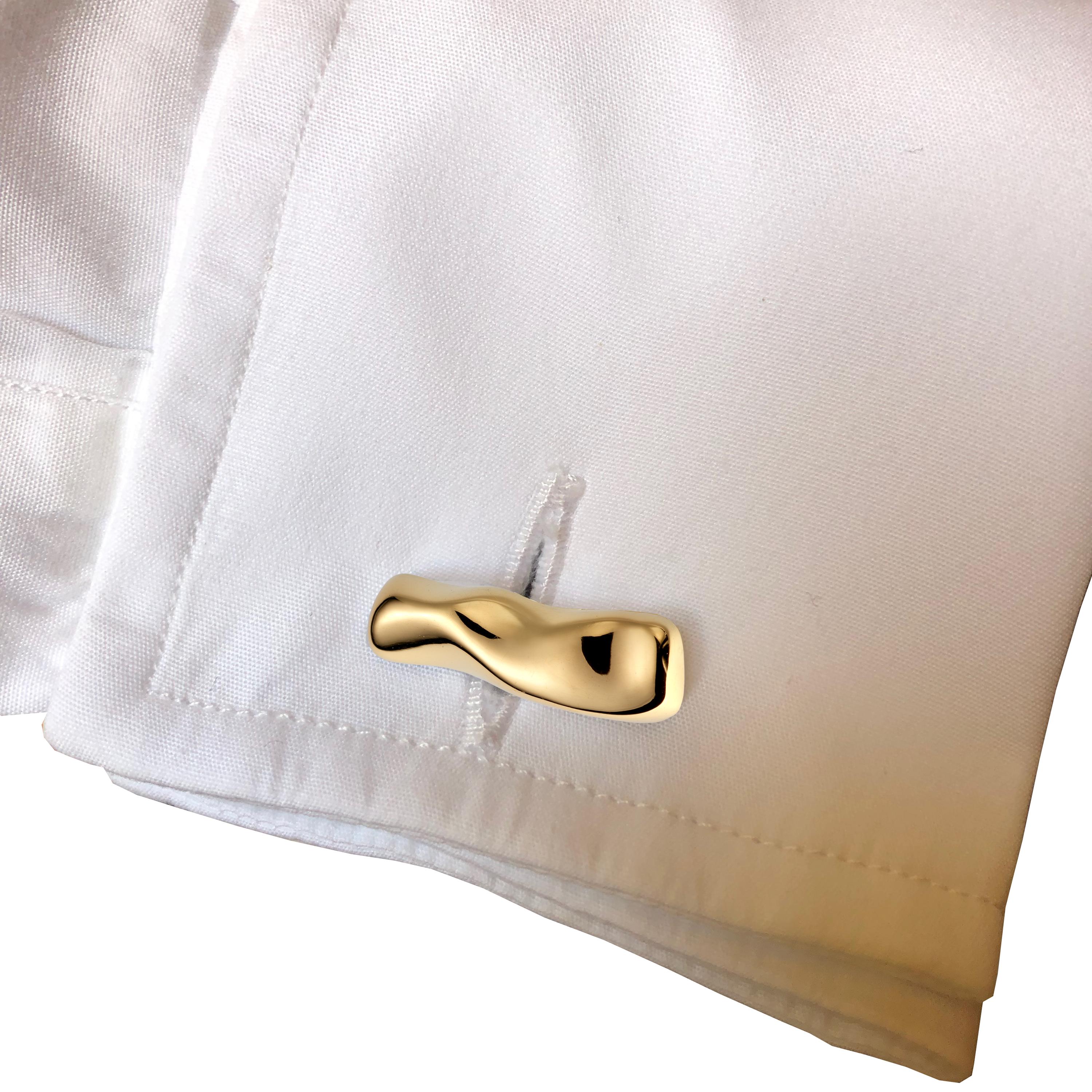 Mercure contemporary Cufflinks in yellow gold are made by hand in Nathalie Jean's Milan atelier in limited edition. Small, delicate, ebbing sculptures with seemingly random forms, these supple shapes are modulated in relief and seem to flow like