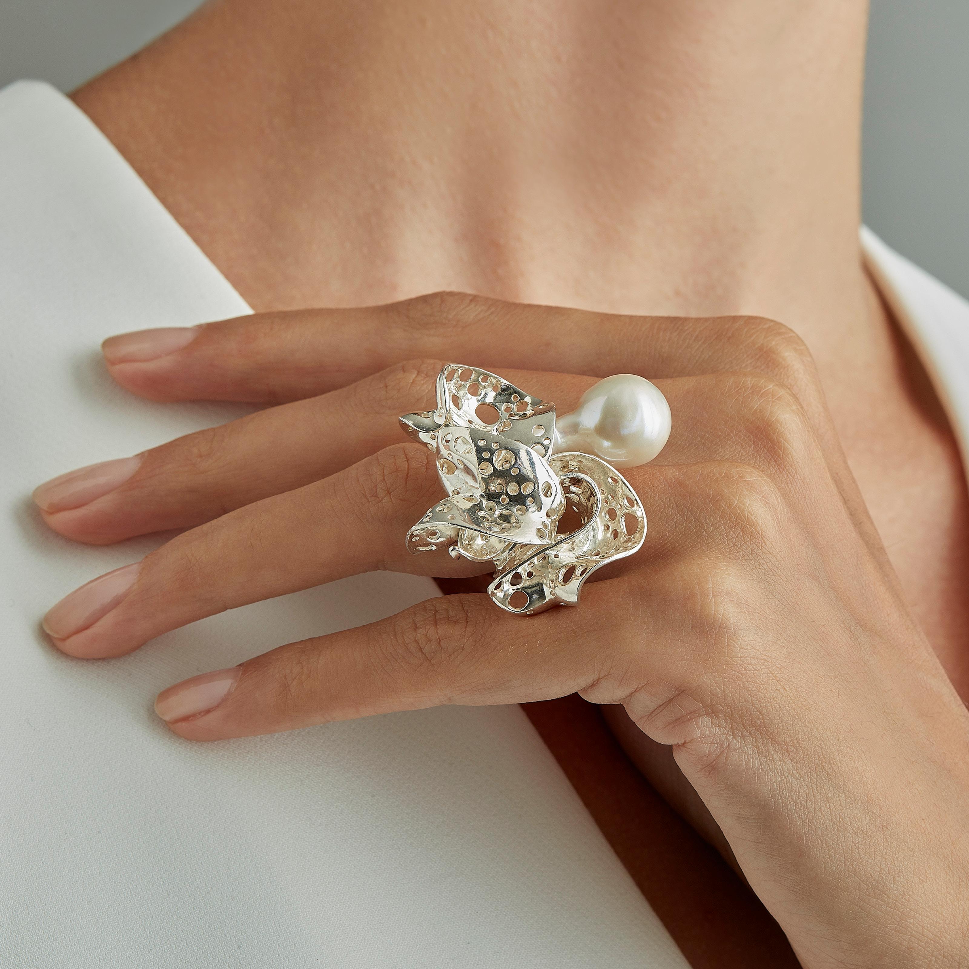 A special Mother's Day Price for Special Mothers :)! 
With their delicate, curved, free-form surfaces, the elements of this sculptural statement ring in sterling silver fold and unfold with harmony and grace like glittering shell fragments or