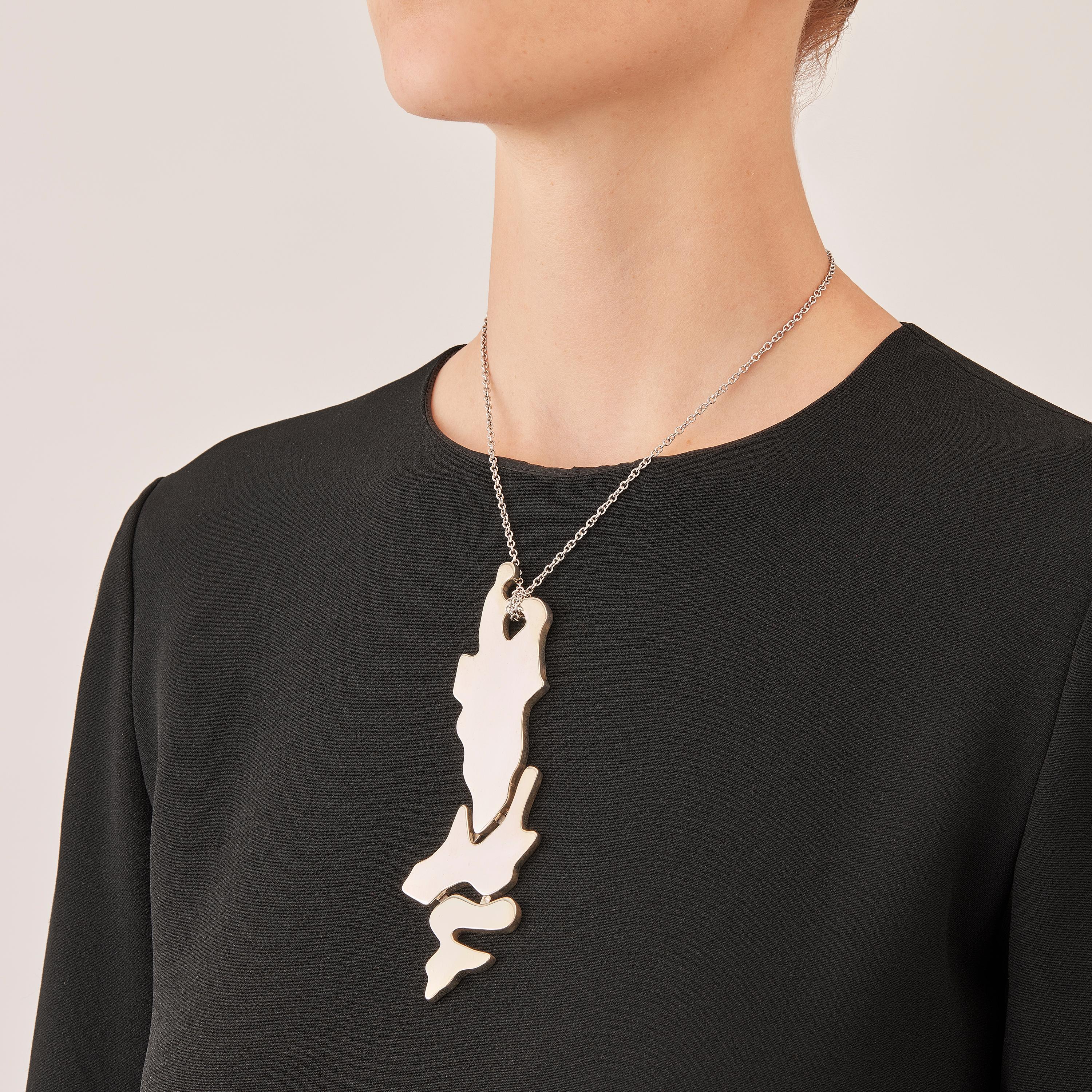 Made by hand in Nathalie Jean's Milan atelier in limited edition, the contemporary Informe Pendant drop necklace necklace is composed of 3 hollow forms of varying dimensions in polished sterling silver. It's little concealed links allow the piece to