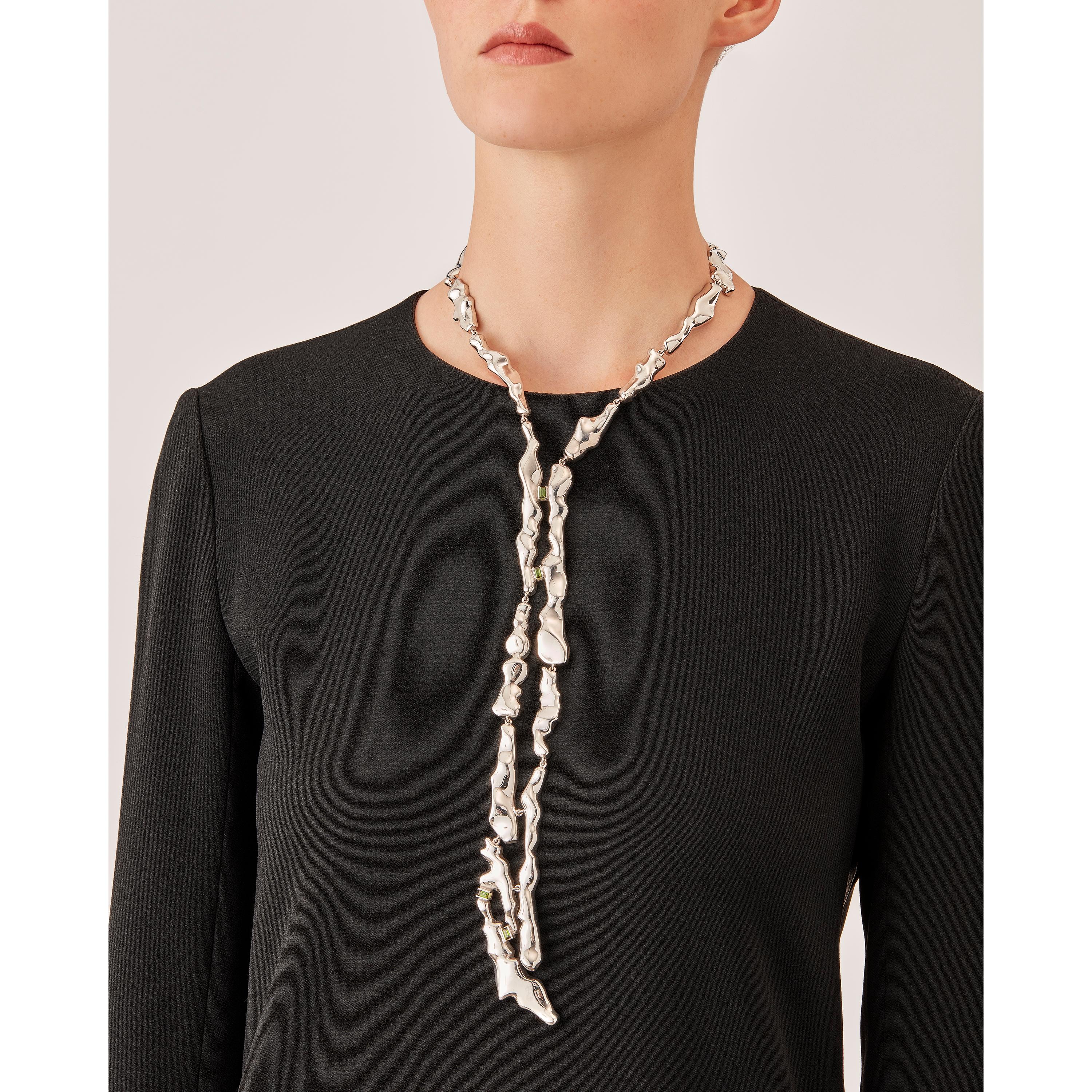 Made by hand in Nathalie Jean's Milan atelier in limited edition, Mercure Tie Necklace is composed of 19 elements of varying dimensions in rhodium plated sterling silver. Clever hidden links allow the pieces to drape nicely around the neck and drop