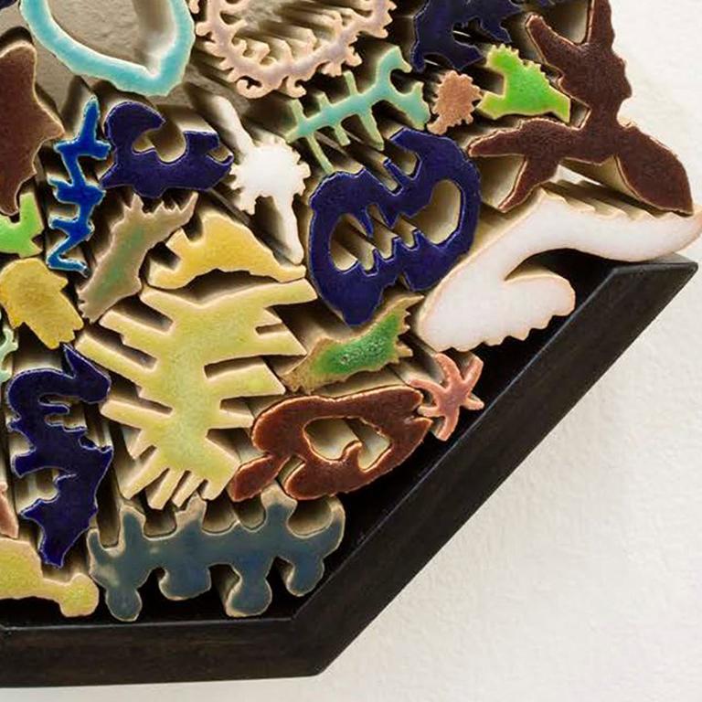 Ceramic artist Nathan Craven designs small extruded ceramic piece—numbering from hundreds to tens of thousands—and then stacks, arranges and balances them to function as both pure decoration and structural objects. The resulting formations serve as
