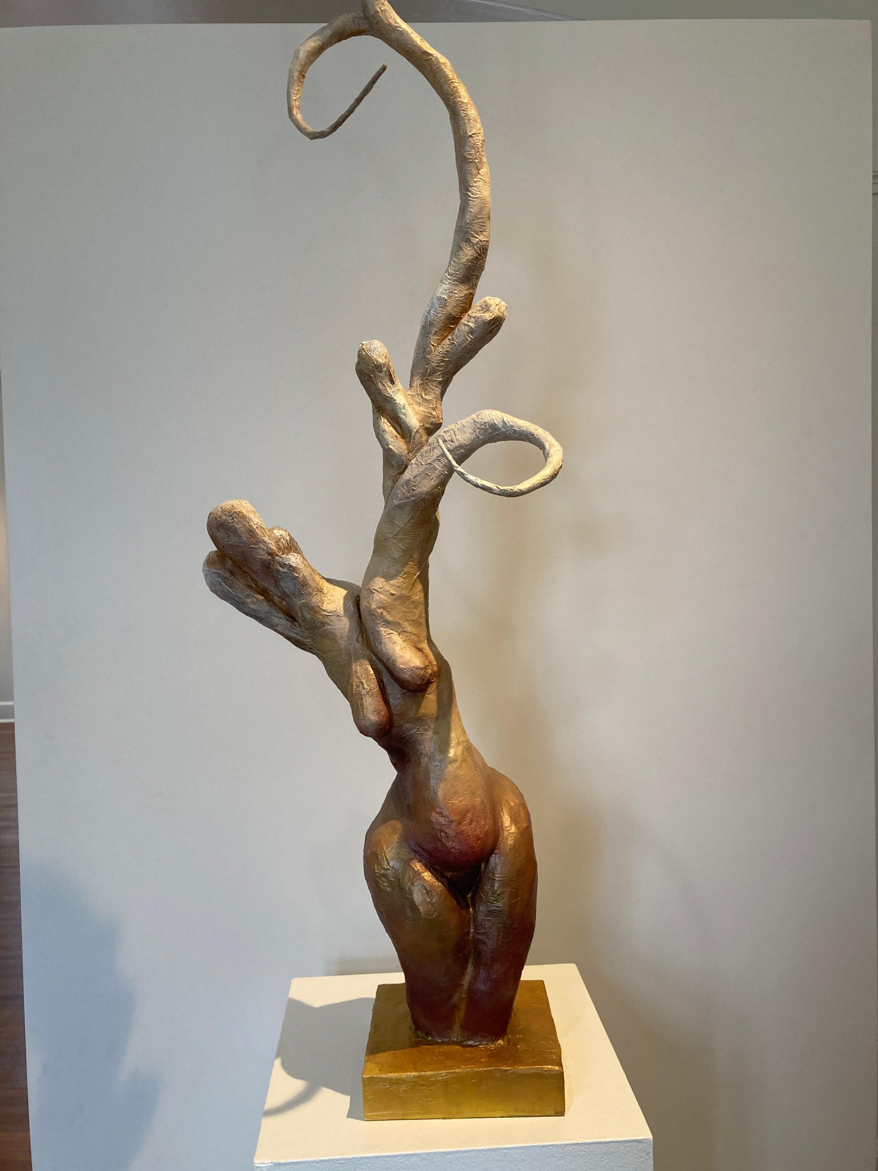 African-American artist Nathan Lee's mixed-media sculpture, 'Phoenix,' explores the idea of resurrection and reinvention. The figure reaches for an unseen goal having been reborn from a hardened shell similar to a moth emerging from a chrysalis.