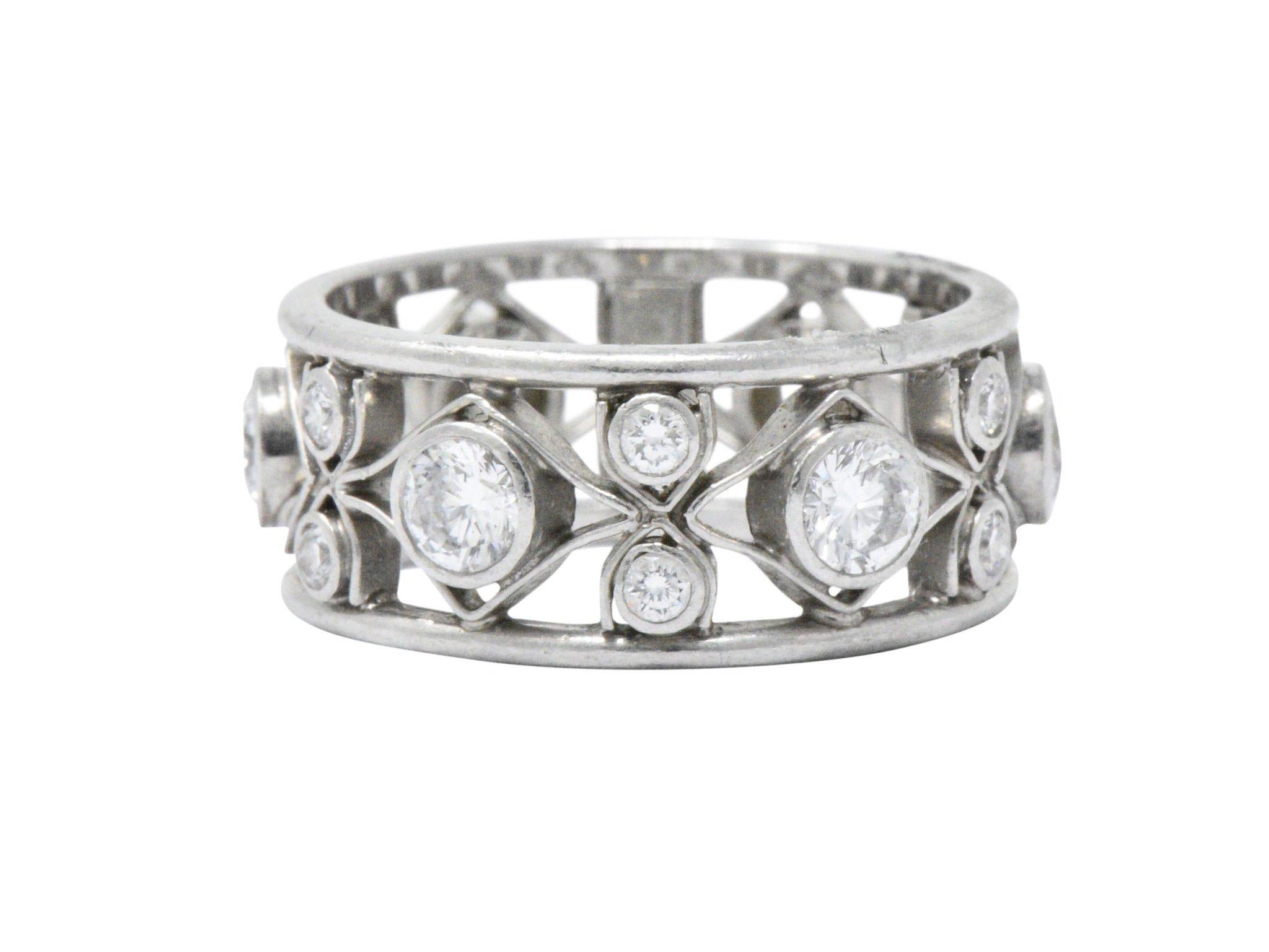 Pierced band style ring featuring navette and hourglass motifs, alternating

Bezel set throughout by eighteen round brilliant cut diamonds weighing 1.14 carats, F/G color with VS clarity

Fully signed Nathan Levy and stamped Plat for platinum

Size: