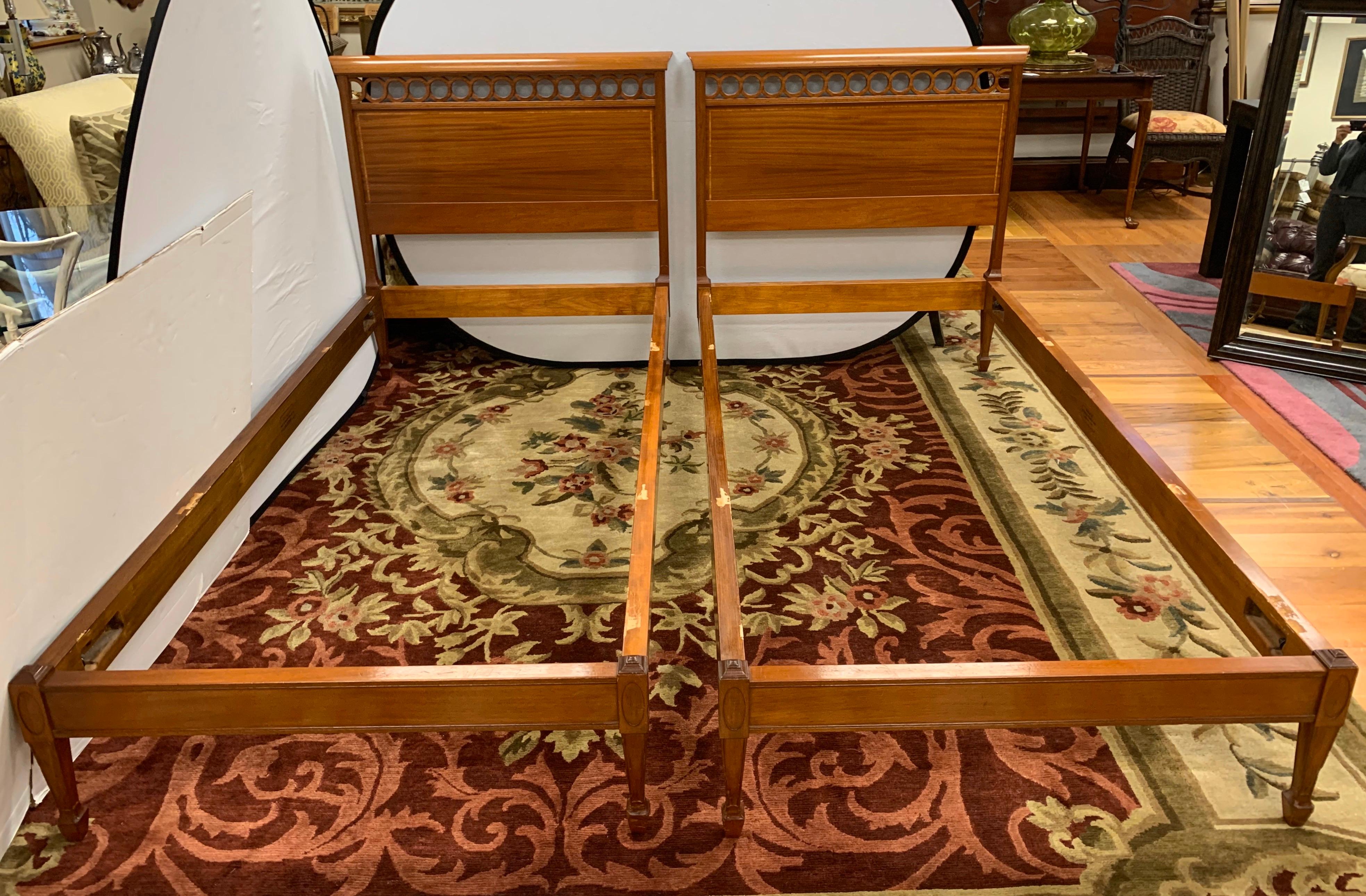 Pair of twin mahogany beds painstakingly handcrafted by The Nathan Margolis Shop of Hartford CT. Each bed consists of a headboard, footboard and side rails.
The shop which was founded by Nathan, officially began in 1894 and closed its doors in