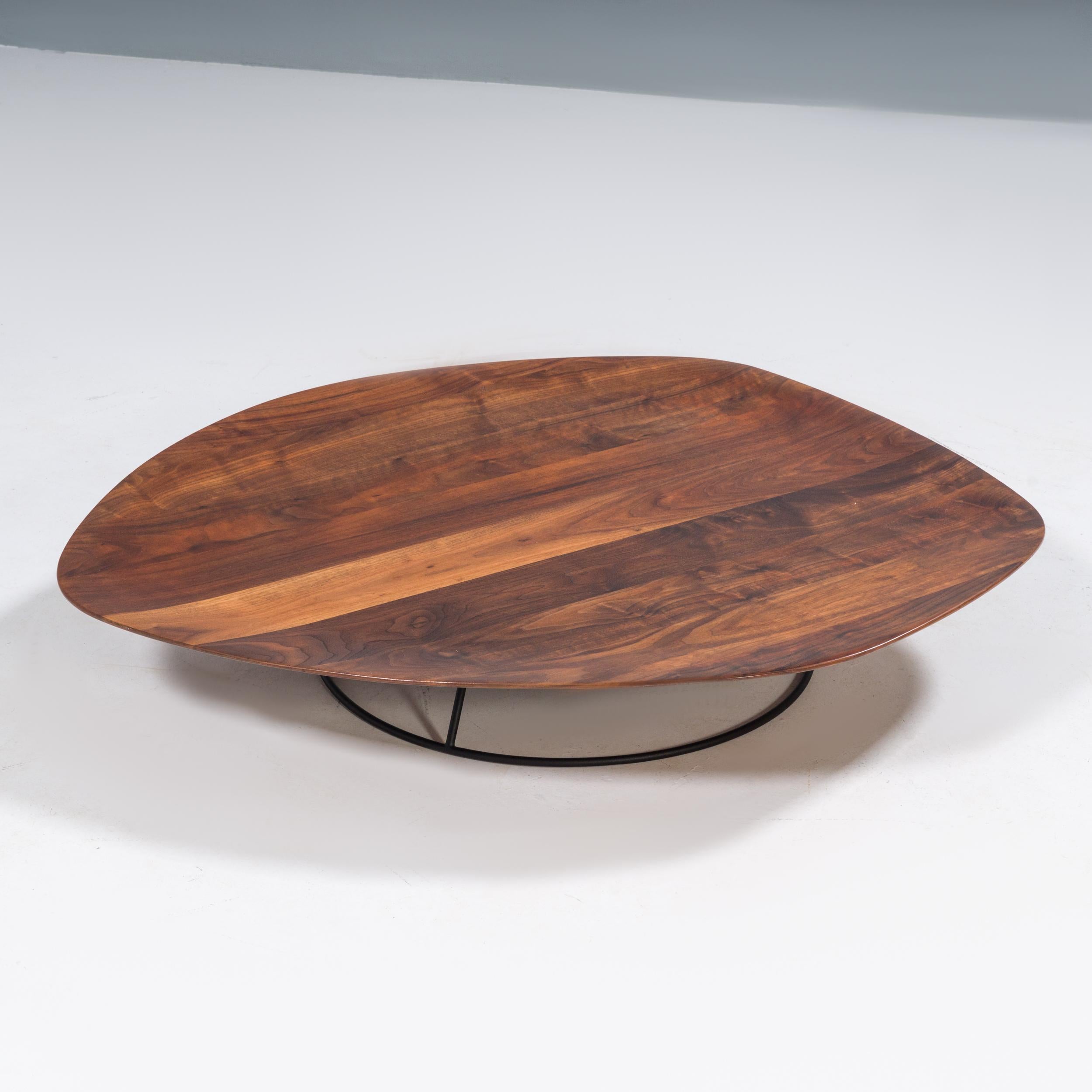 Originally designed by Nathan Young for Ligne Roset in 2008, the Pebble table is a fantastic example of modern design.

Inspired by the form of a stone eroded by a flowing river, the Pebble table has a fluid, organic form.

Featuring a carved