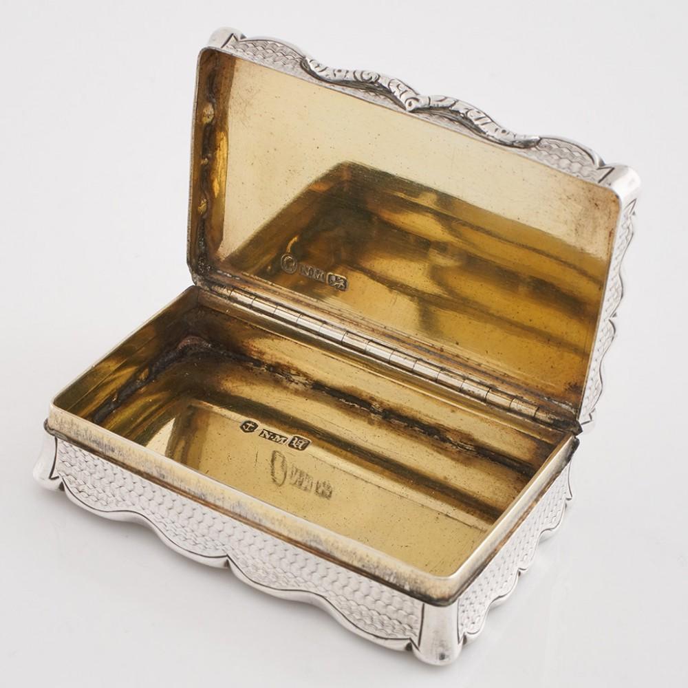 Heading : Sterling silver snuff box
Date : Hallmarked in Birmingham in 1843 for Nathaniel Mills
Period : Victoria
Origin : Birmingham, England
Decoration : Embellished with tooled crosshatching, cartouche with dedication : 