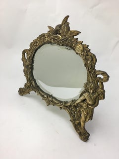 National Bronze and Iron Works Gilded Iron Mirror with Putti