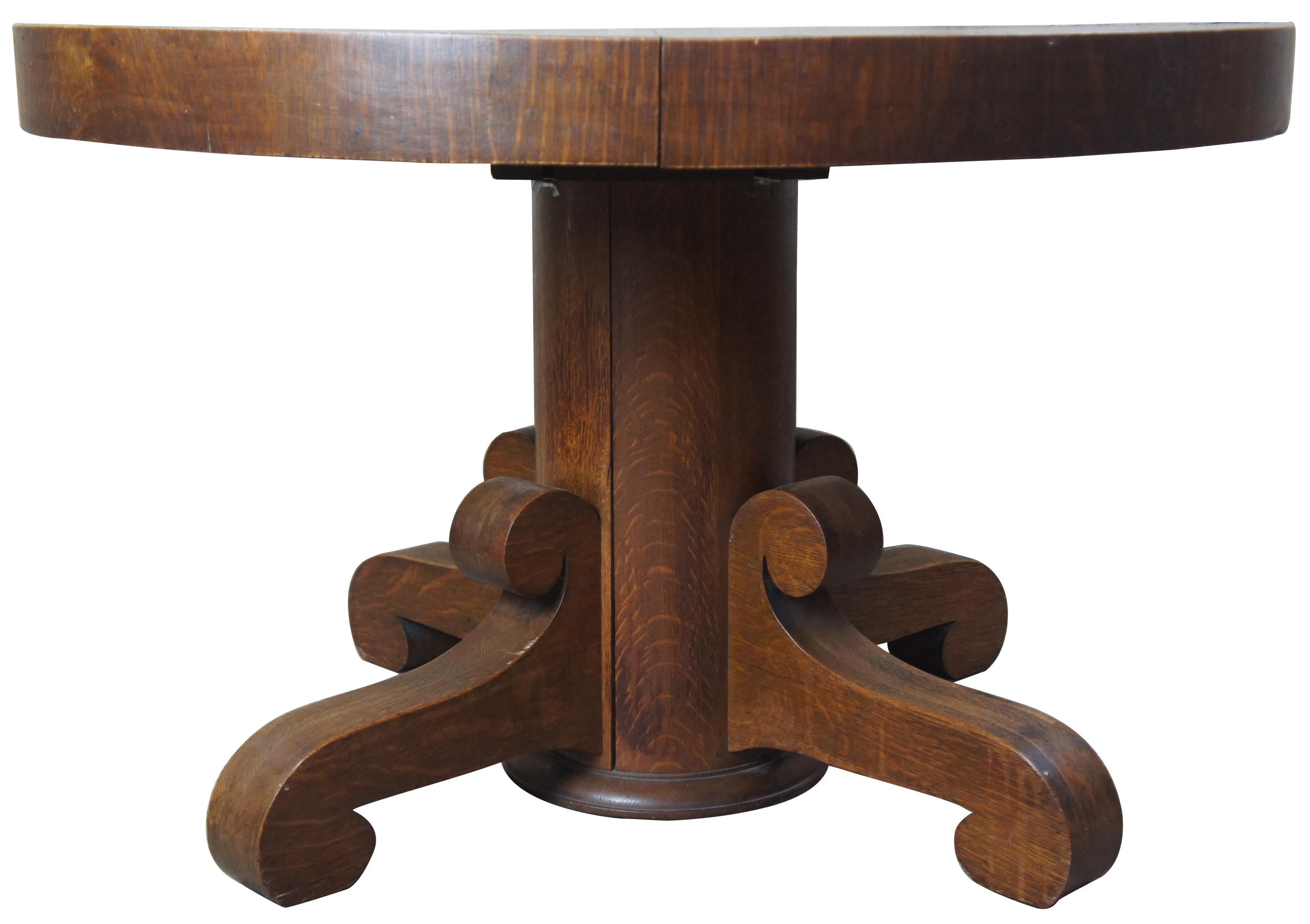 National Furniture Co antique Empire Quartersawn oak round dining table

Late Victorian Empire inspired dining table from National Furniture Company, circa 1900s. Made from quartersawn oak with scrolled feet. Includes 3 leafs for extension and