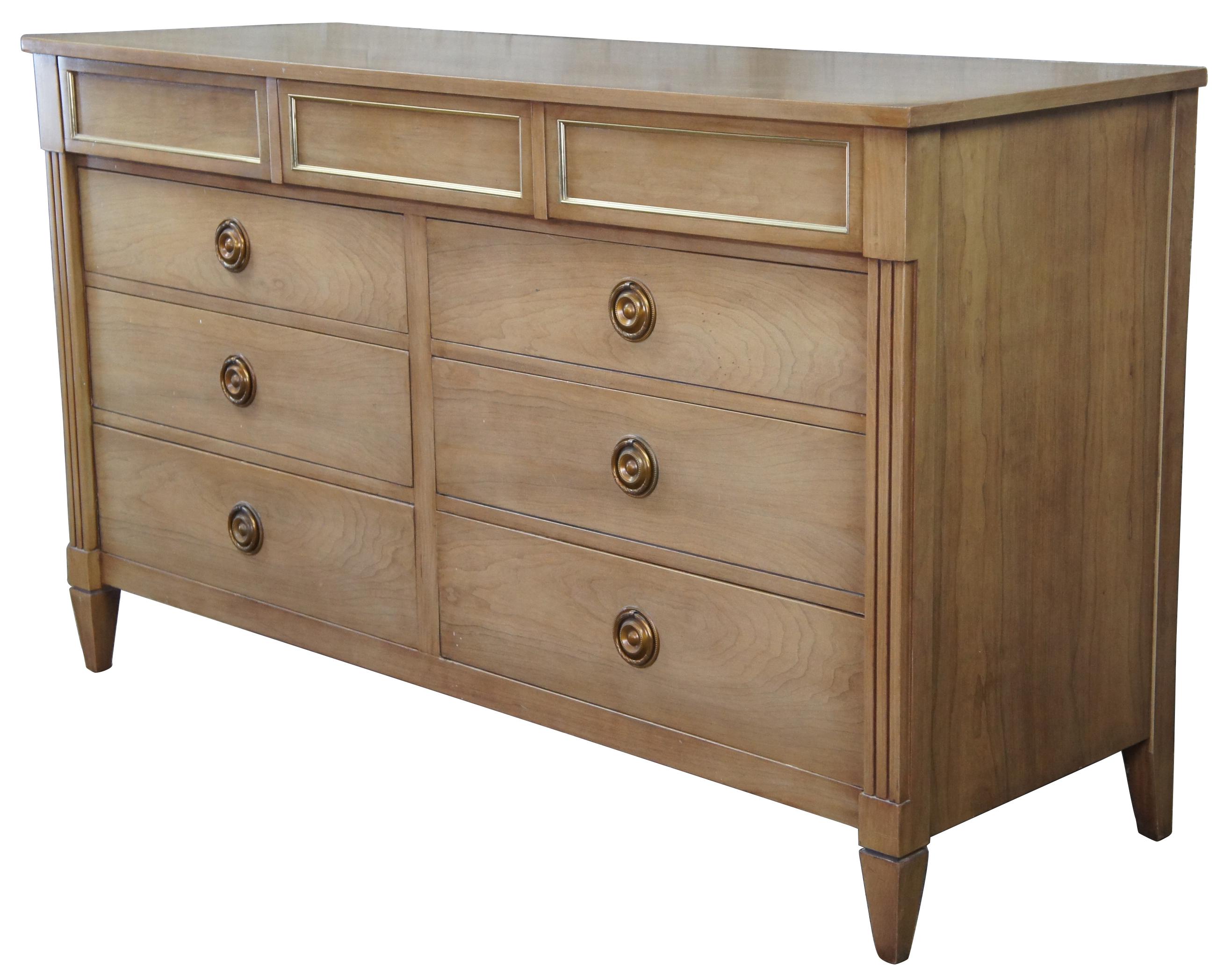 Vintage National Furniture Company double dresser. Made of walnut featuring Louis XVI styling with nine drawers and neoclassical hardware. Made in Mt. Airy, North Carolina.
  