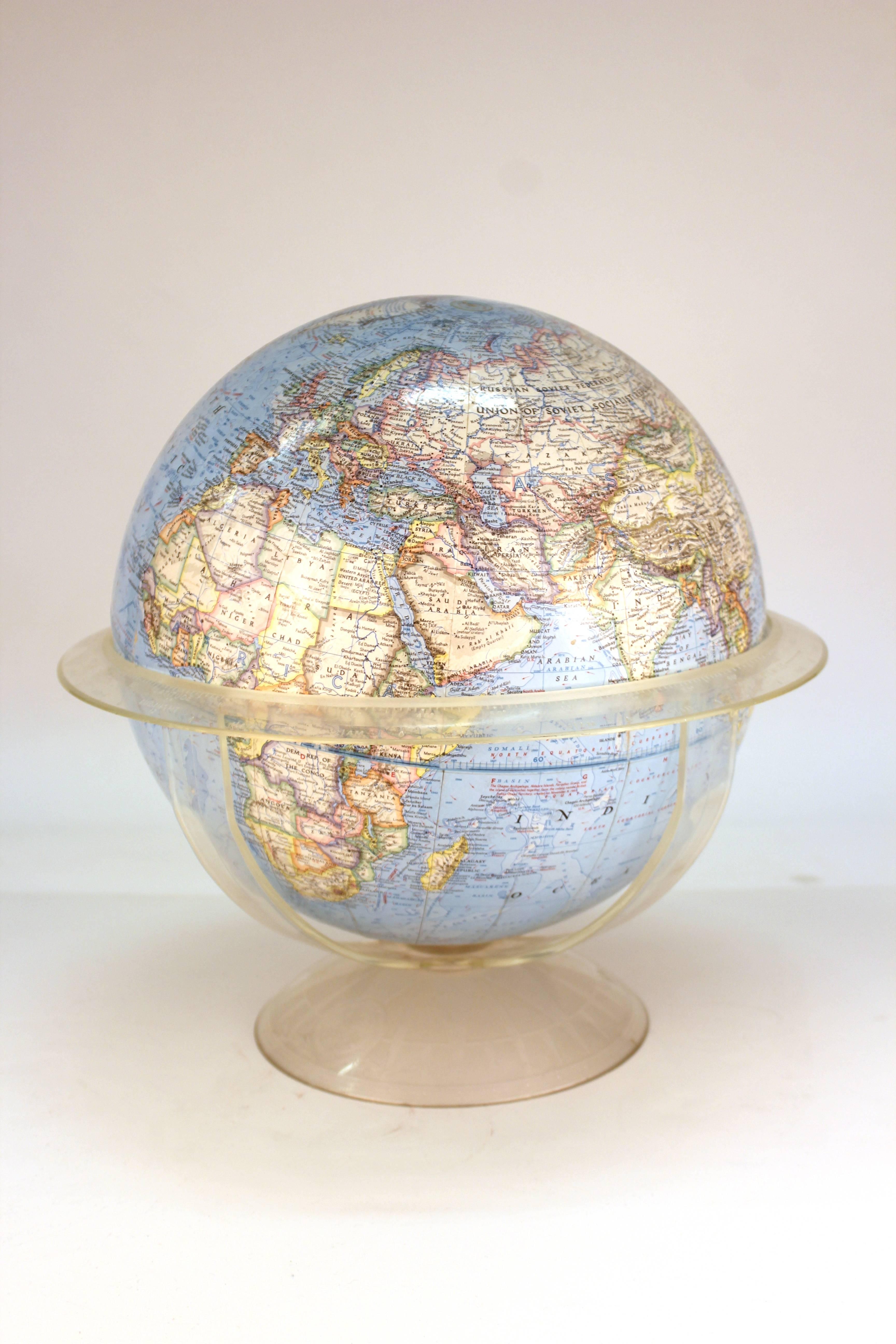 A National Geographic globe, made in 1966 in the United States. The piece is in good condition with some loss to the paper finish.