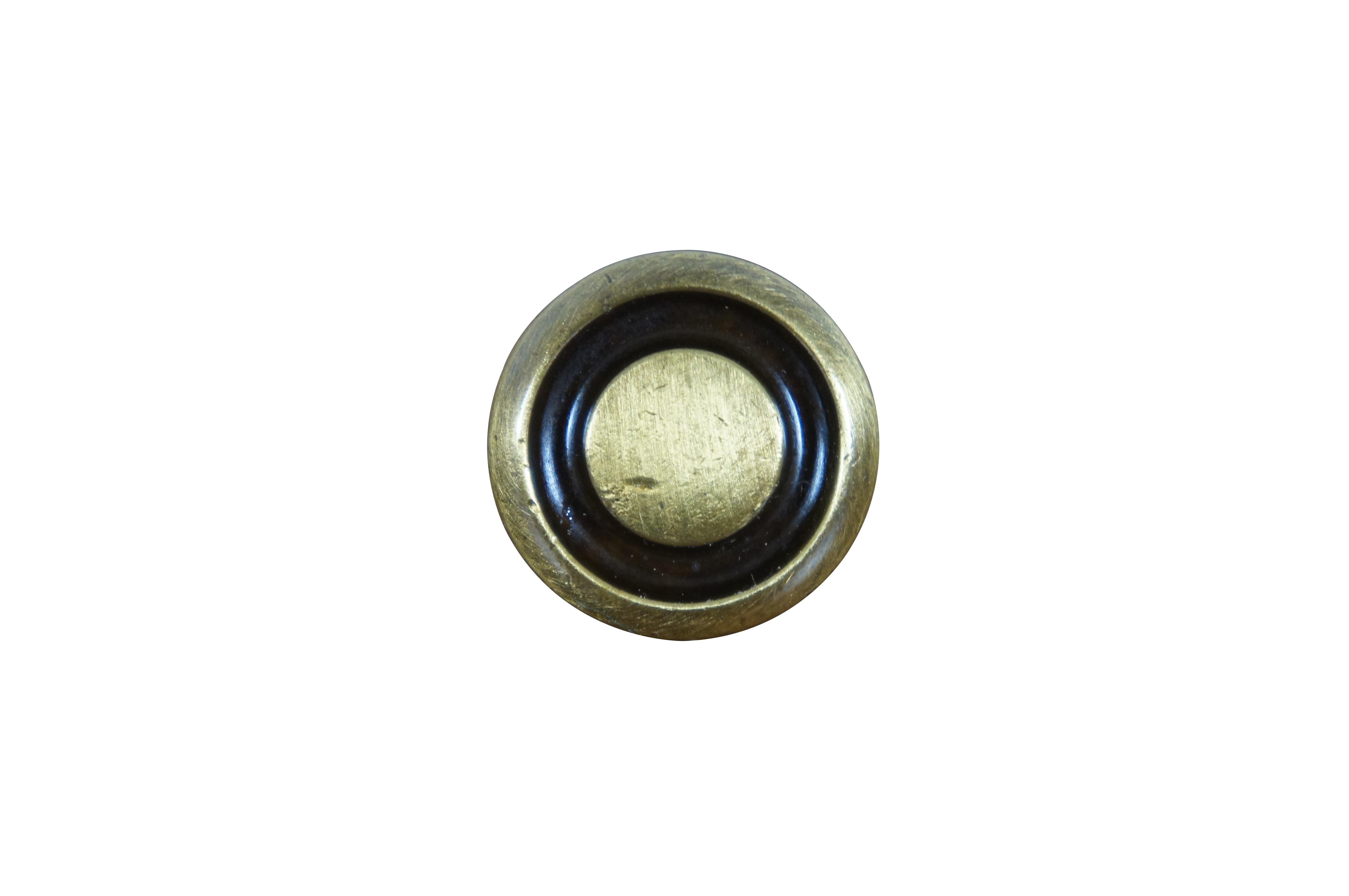 23 Available - Mid to late 20th century old-stock drawer / cabinet pulls. National Lock Company - Medalist, item number C274-4A Knob, Antique Brass. Round button shape with dark, recessed groove. 

Dimensions:
1