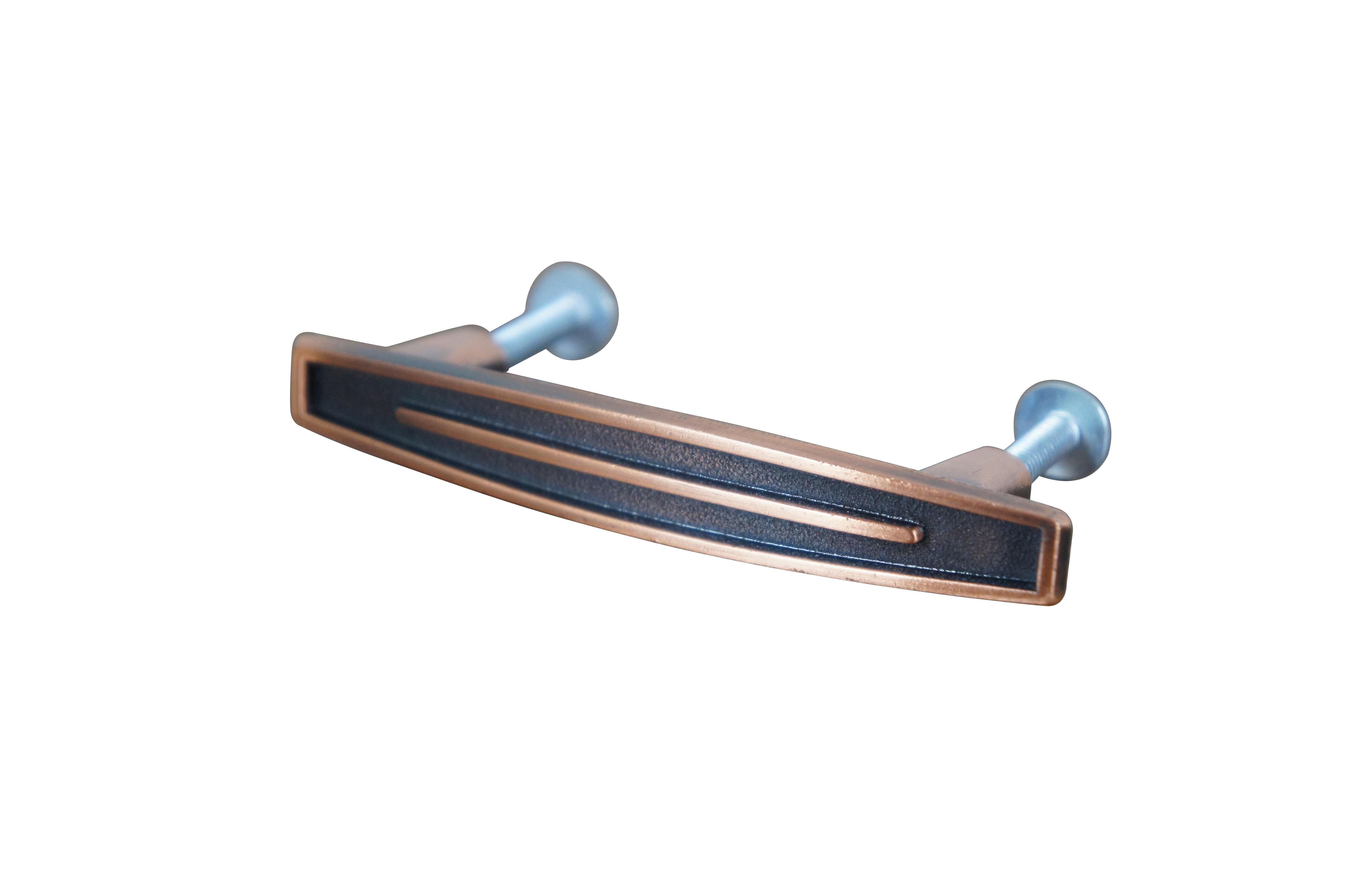 20 Available - Mid to late 20th century old-stock die cast metal drawer / cabinet pulls. National Lock Company - Medalist, item number C634-10D. Antique old copper finish. Mid century modern styling. Bowed out, rounded rectangular shape with
